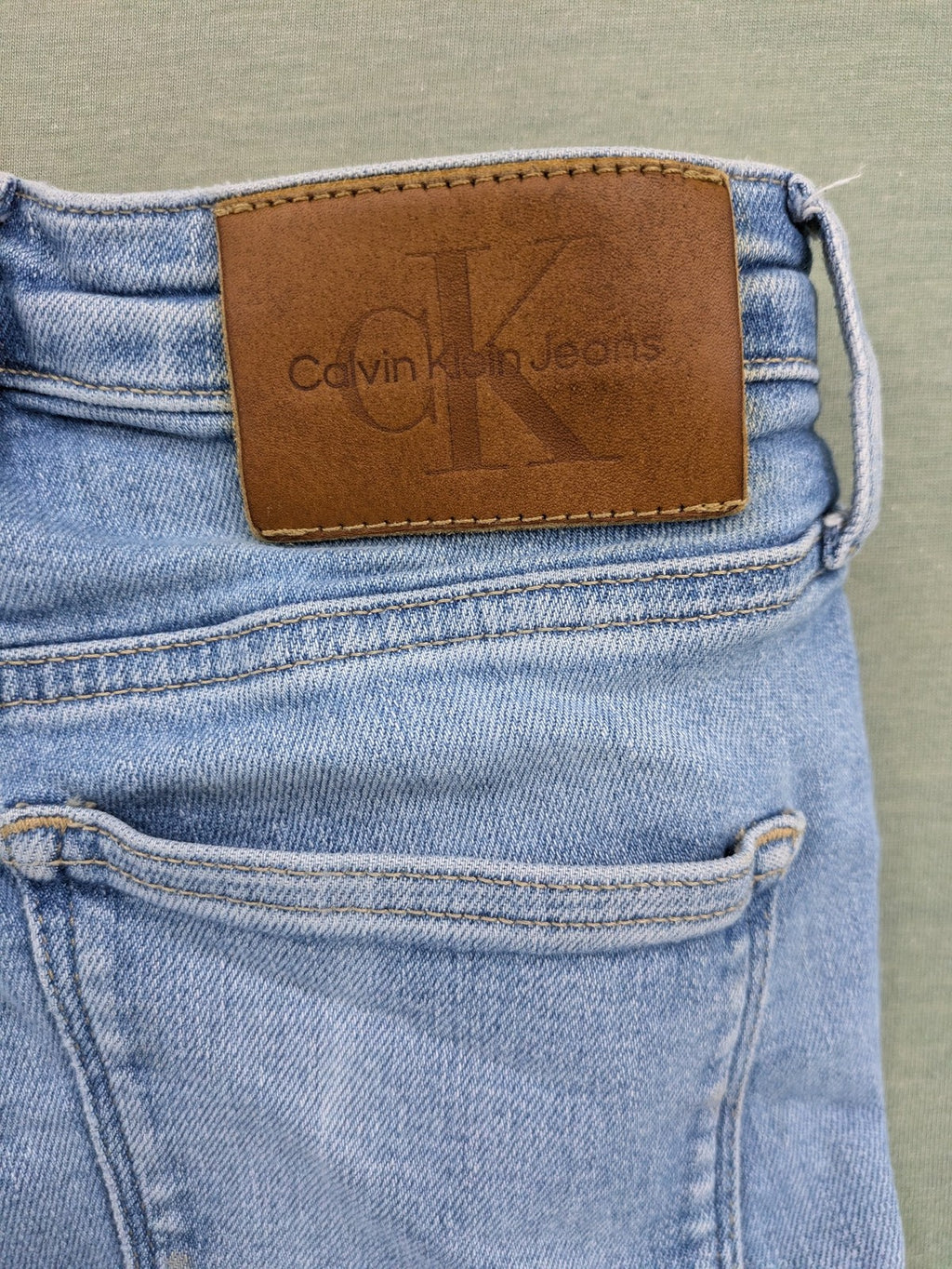 Calvin Klein Jeans blue high rise super skinny ankle jeans with logo patch and stretch material.