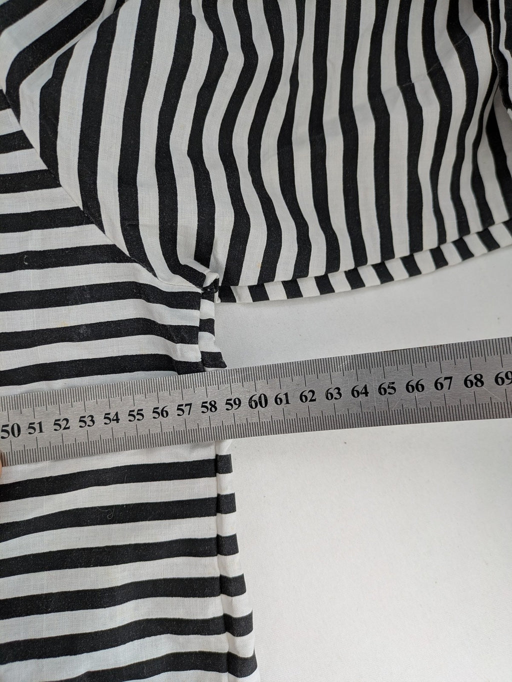 Rubie's costume set black and white striped with prisoner number patch on chest.