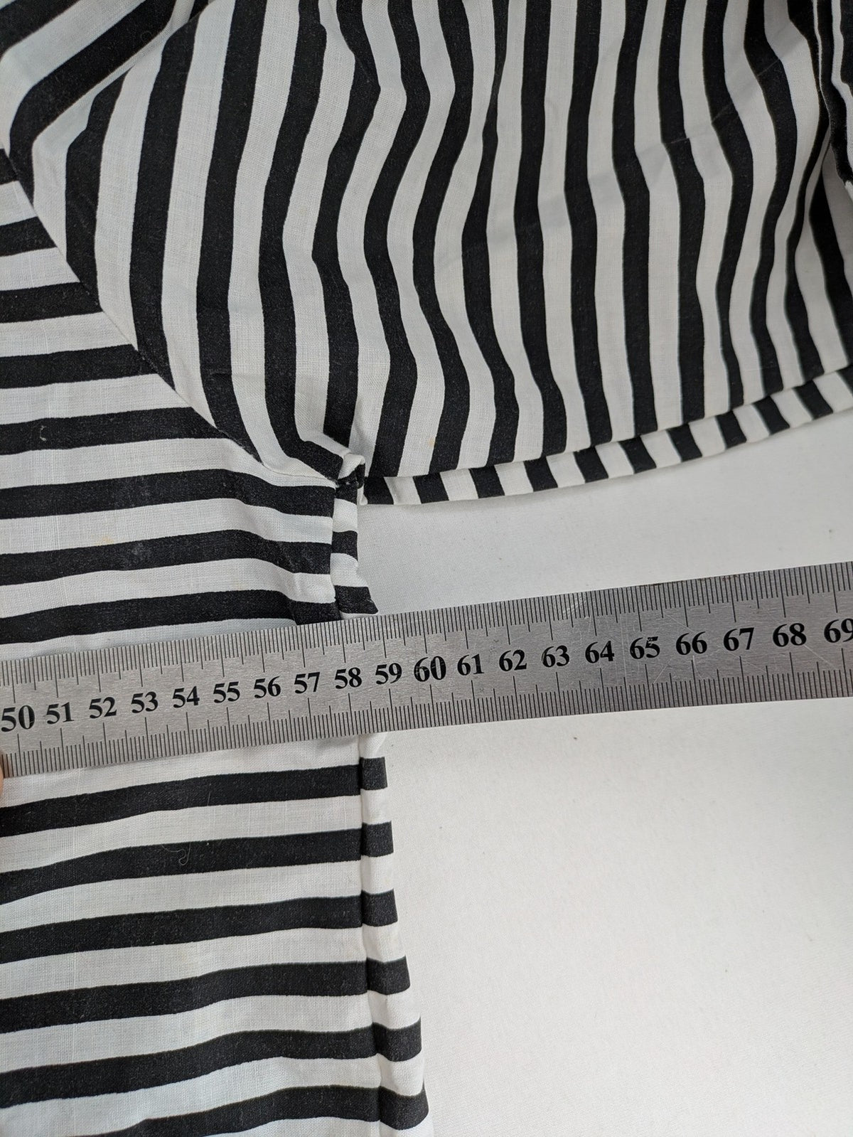 Rubie's costume set black and white striped with prisoner number patch on chest.