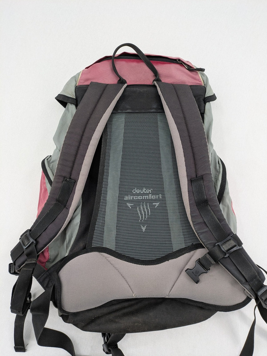 Deuter grey and pink Aircomfort Walk Air 30 rucksack with mesh back system.