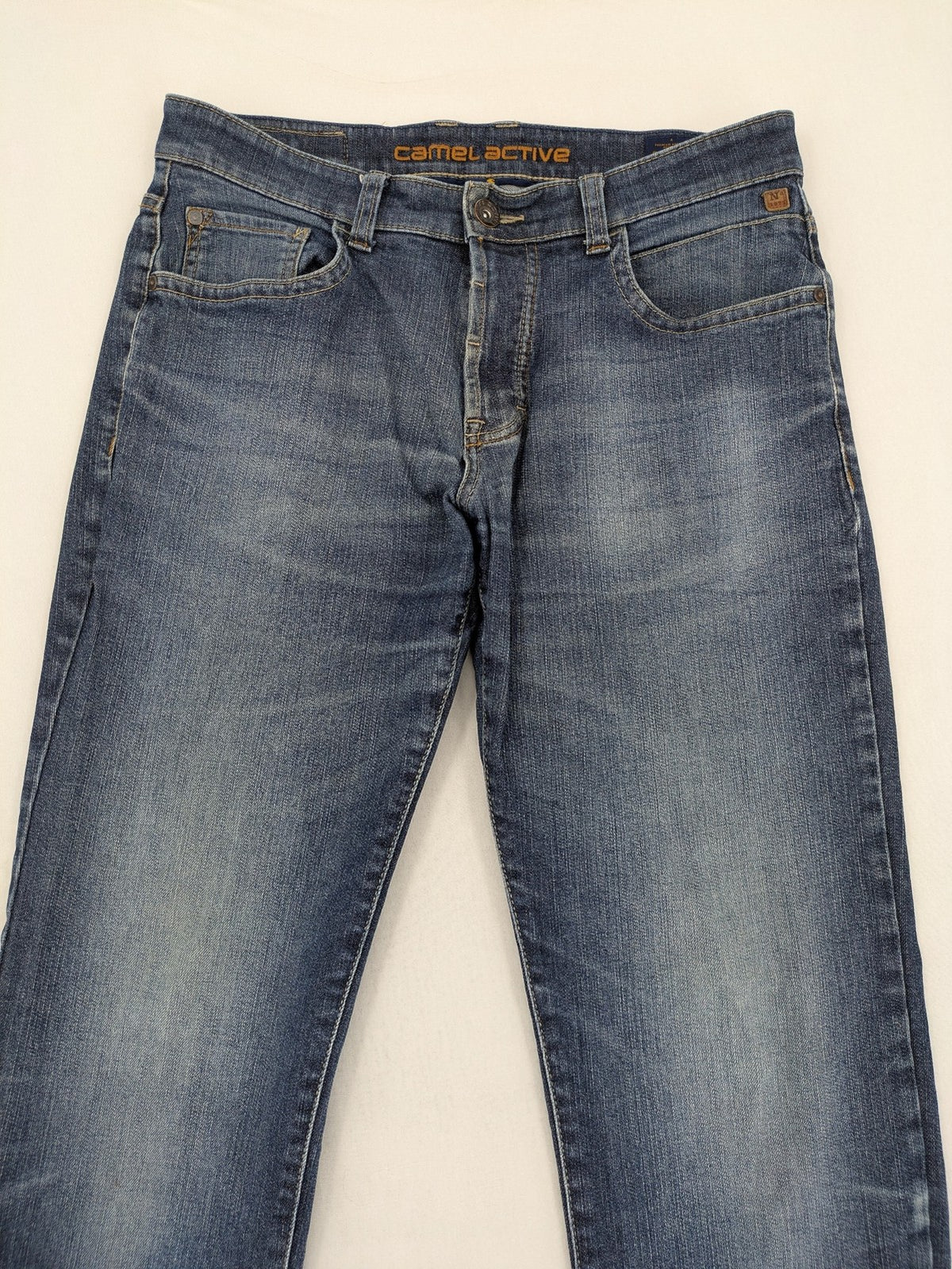 Camel Active blue straight jeans with classic 5-pocket design and logo patch.