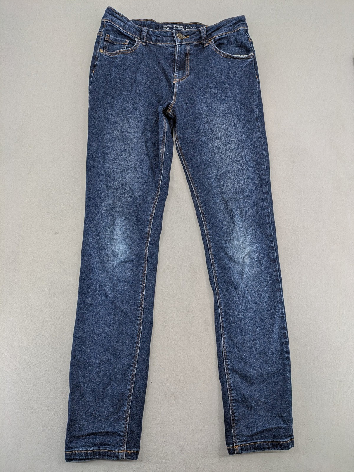 Denim & Co. blue skinny stretch jeans, five-pocket design, dark wash, durable material.