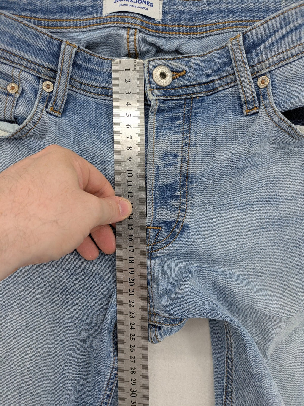 Jack & Jones blue slim jeans with button fly and subtle used look.