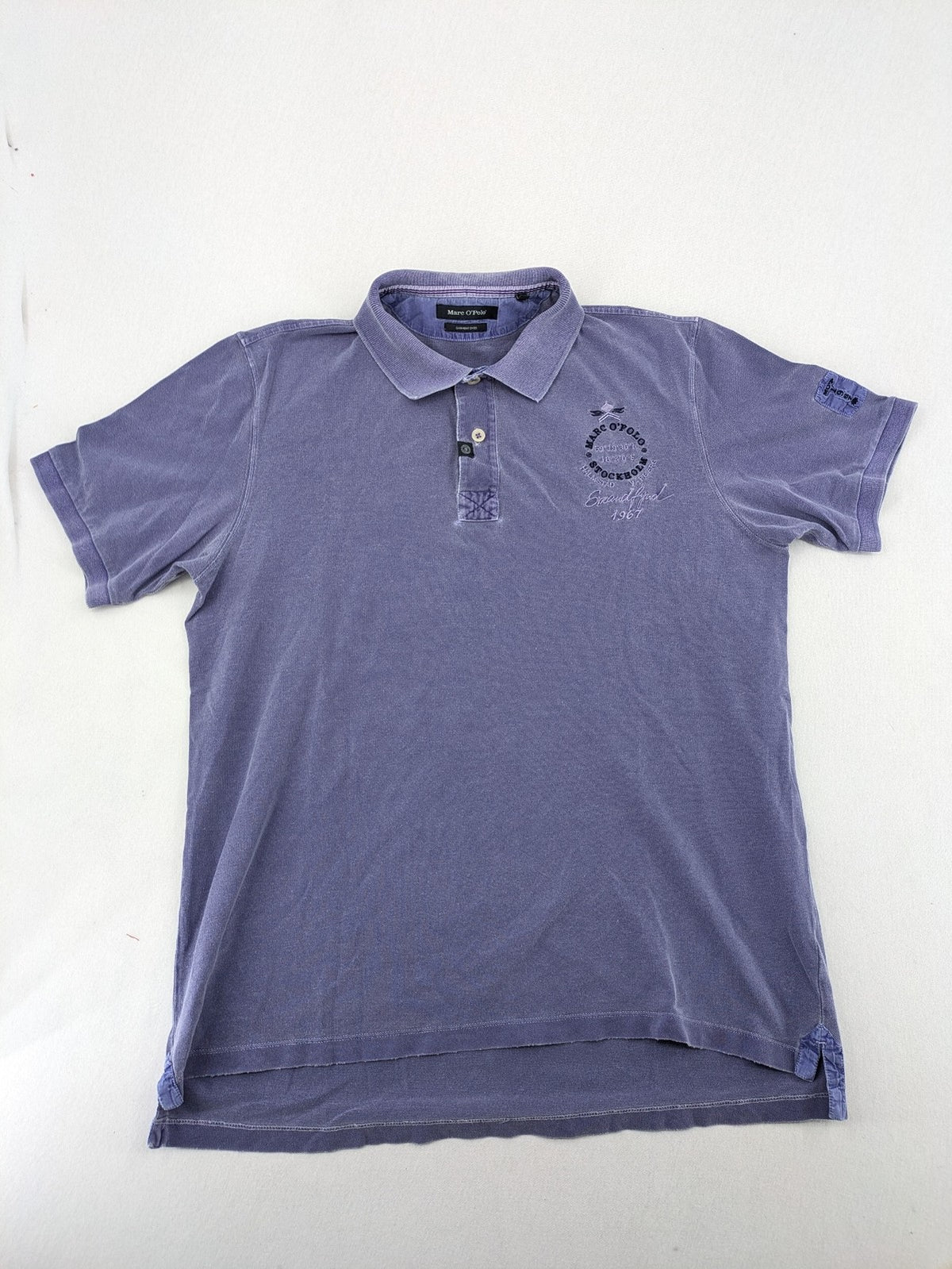 Marc O'Polo purple polo shirt garment dyed cotton with embroidered logo and intricate details.