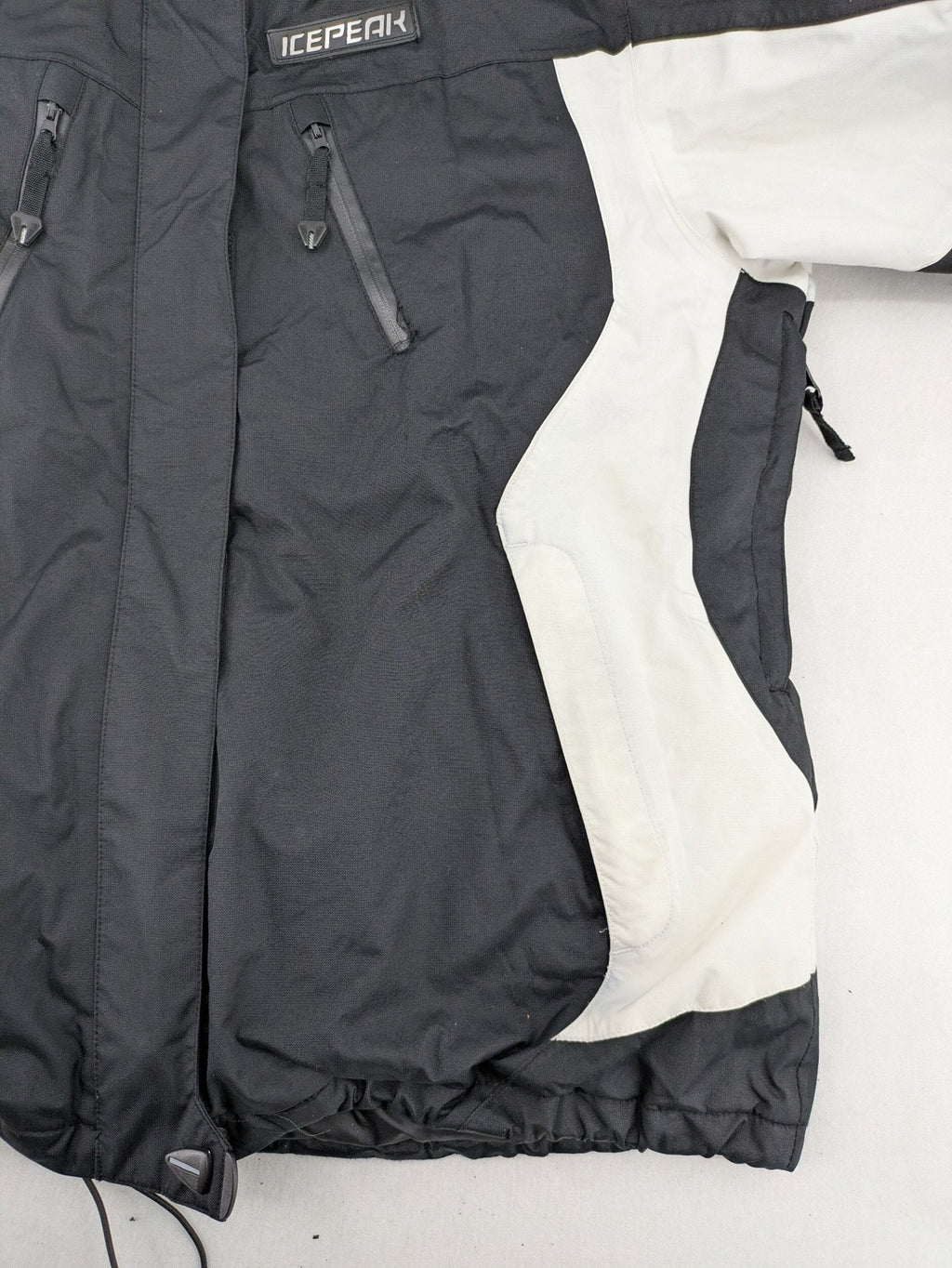 Icepeak black and white ski snowboard jacket with RECCO logo and quilted insulation.