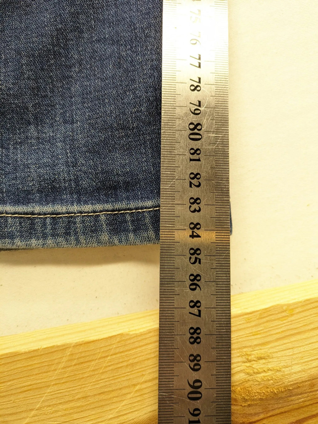 WAM Denim blue straight jeans with distressed details and button fly.