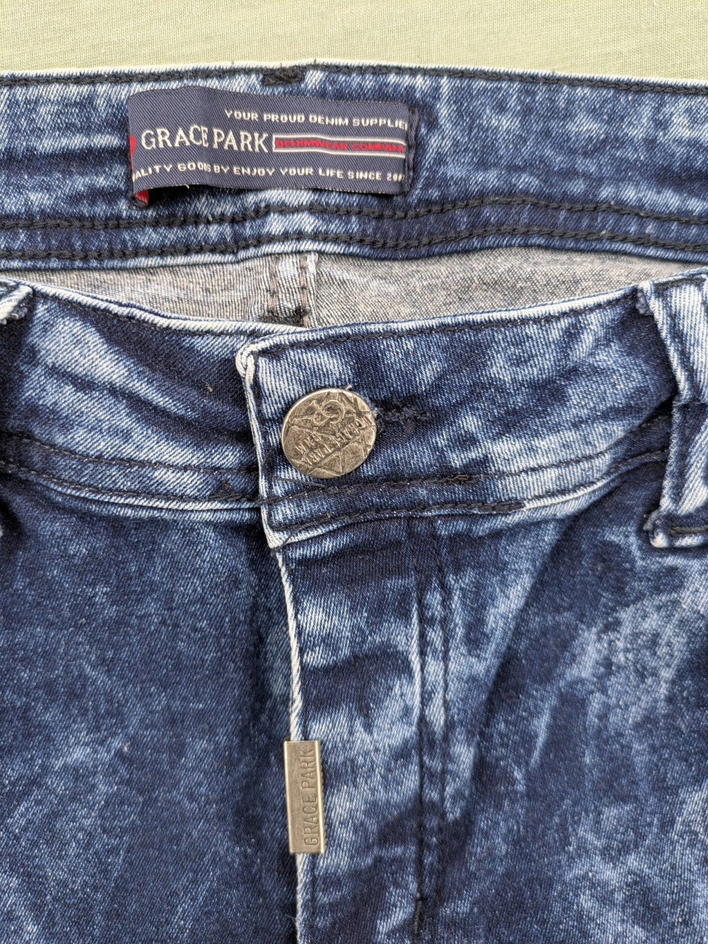 Stark straight jeans multi distressed acid wash with orange patches and side stripes.