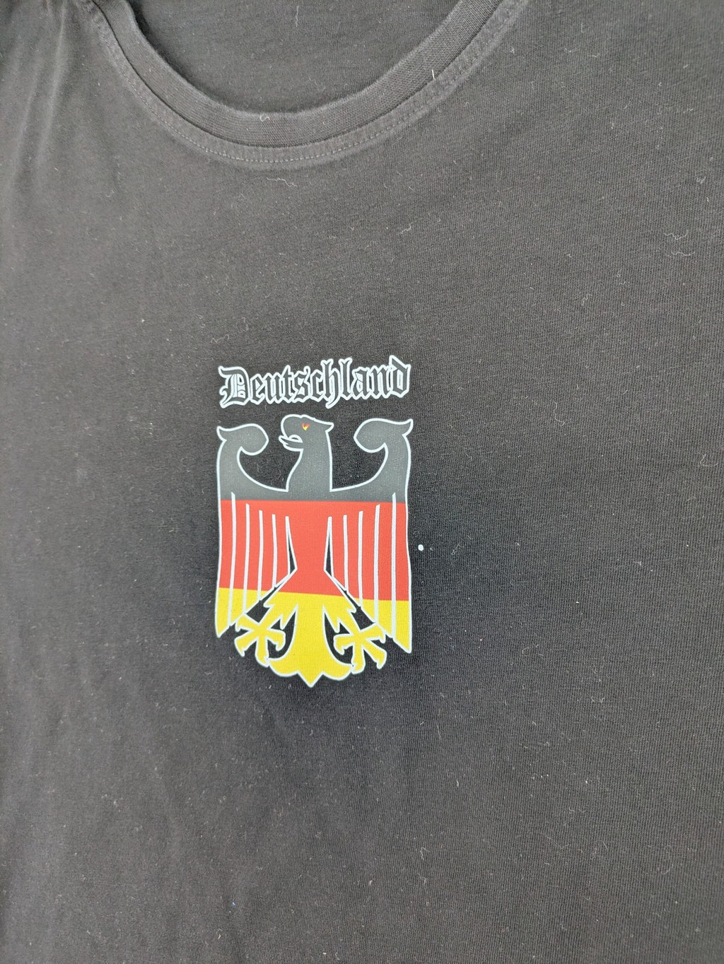 Tom Tailor black T-shirt with Germany eagle crest and flag colors, 100% cotton.