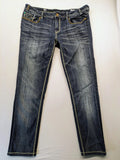 Rhodes blue skinny jeans with decorative studs and intricate embroidery on back pockets.