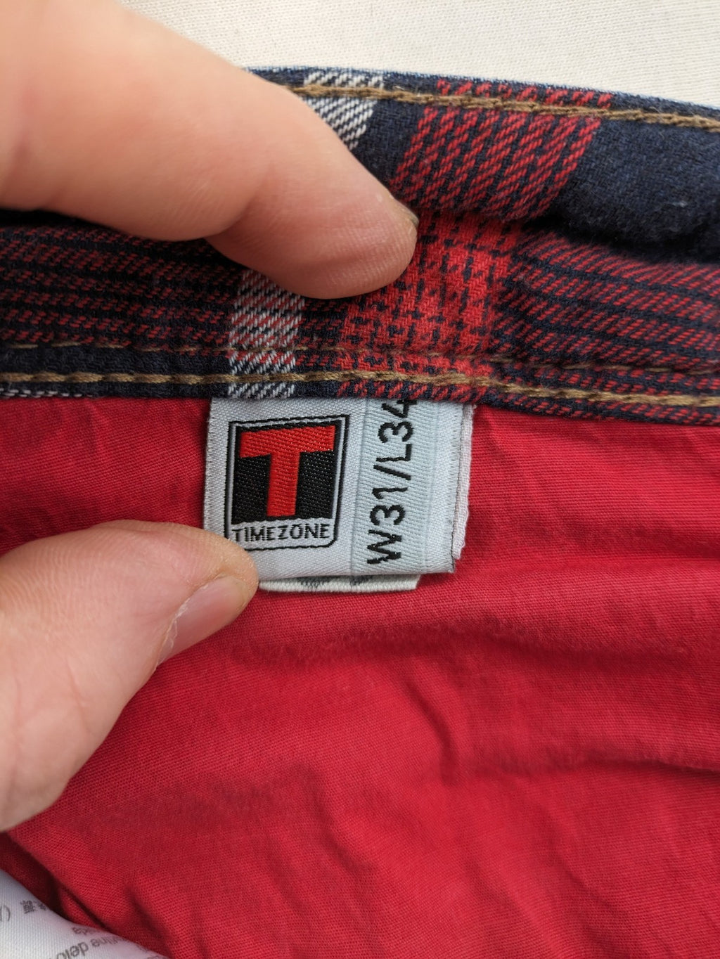 Timezone blue straight jeans slim fit with checkered pattern lining and button fly.