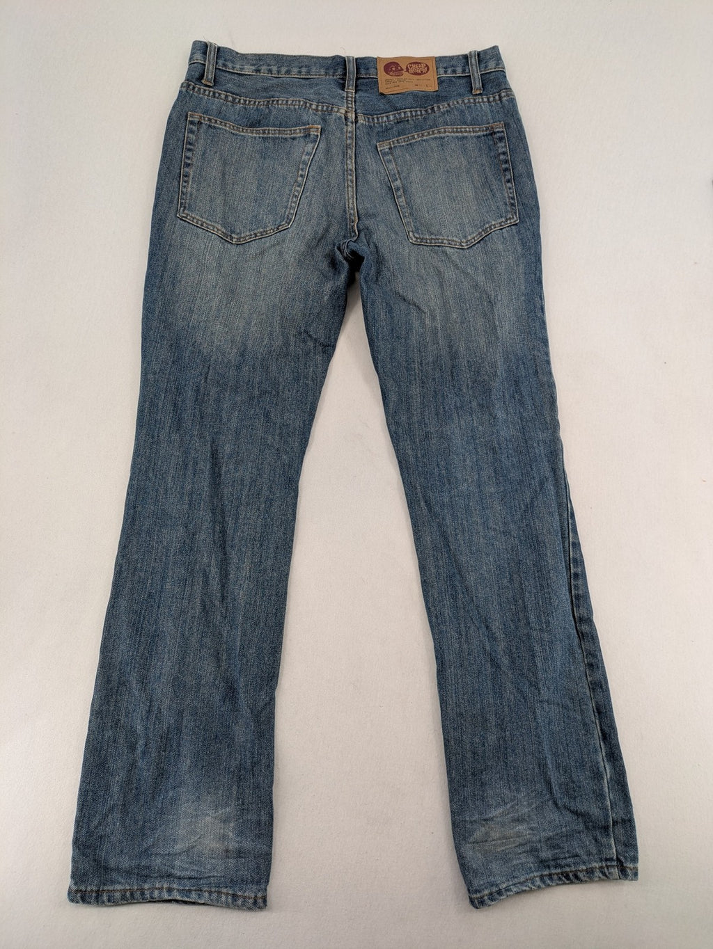 Cheap Monday blue straight jeans with button fly and classic medium wash finish.