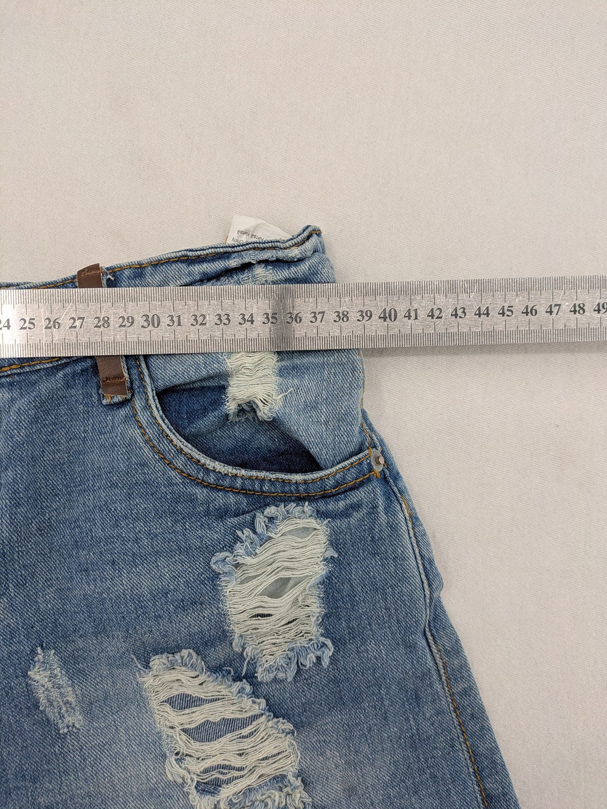 Daysie blue boyfriend jeans shorts with distressed rips and classic 5-pocket design.