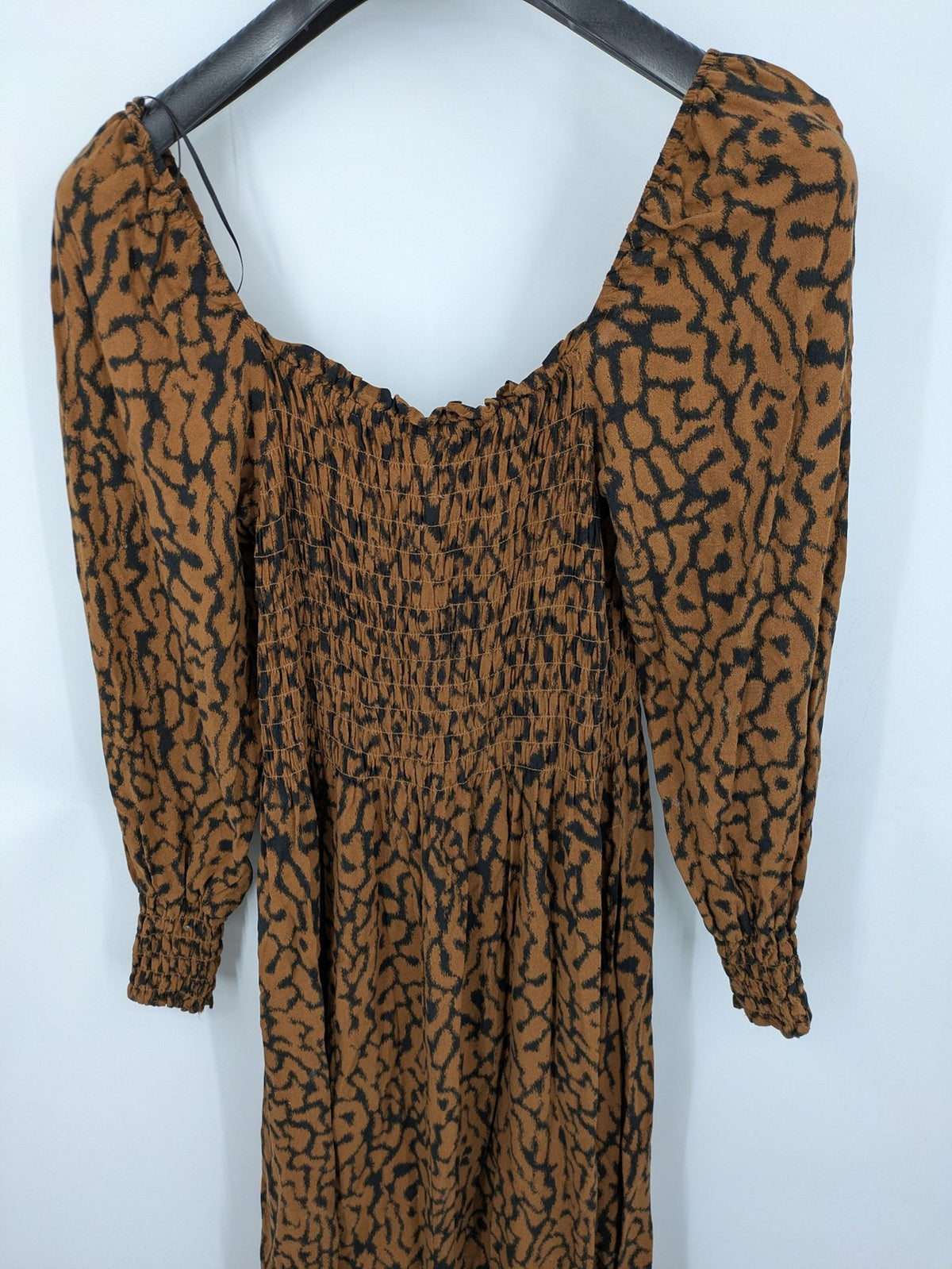 H&M brown and black animal print midi dress with smocked bodice and square neckline.