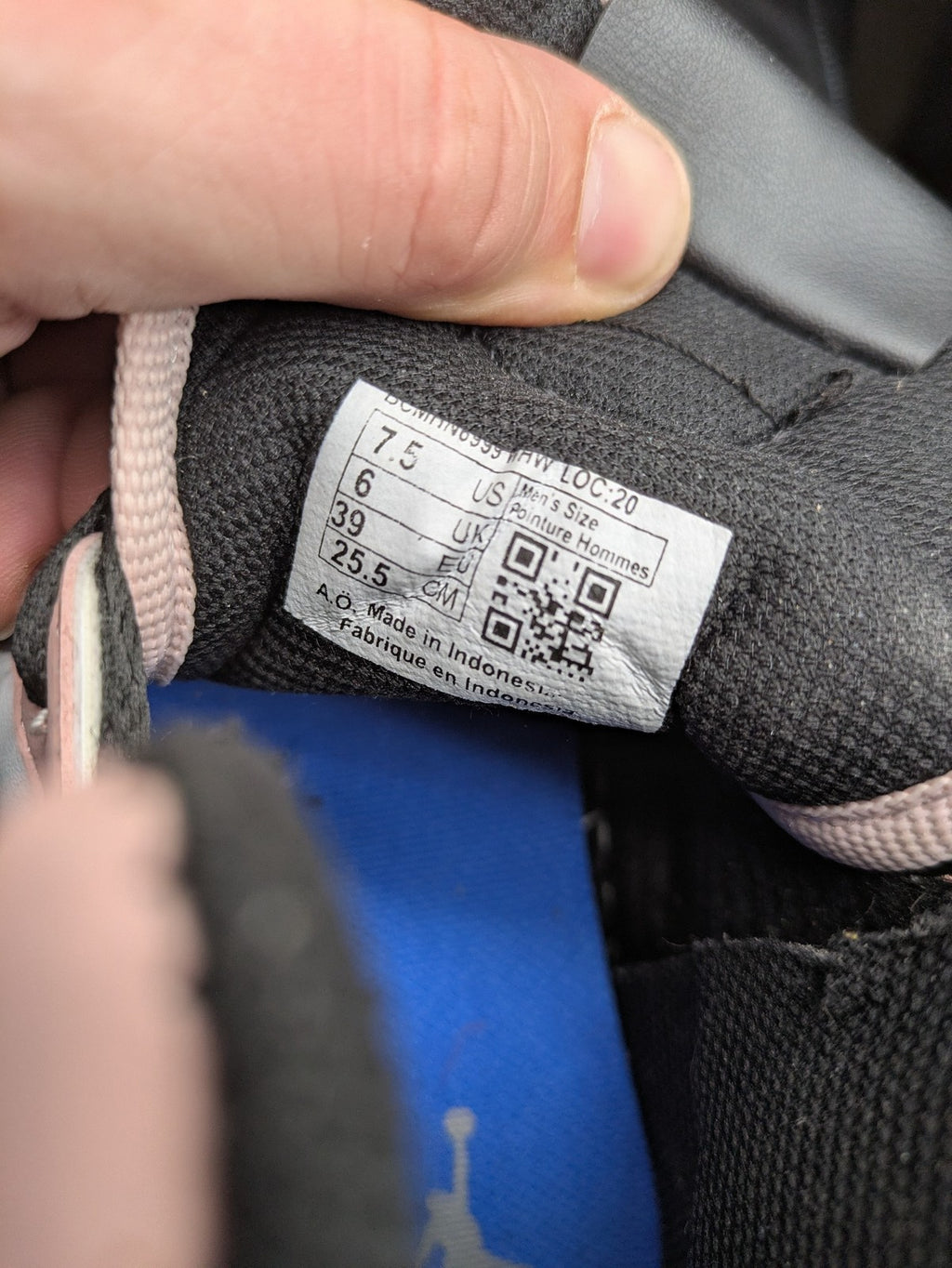 Nike Air Jordan high-top sneakers multi with Wings logo, Jumpman detail, and perforated toe.