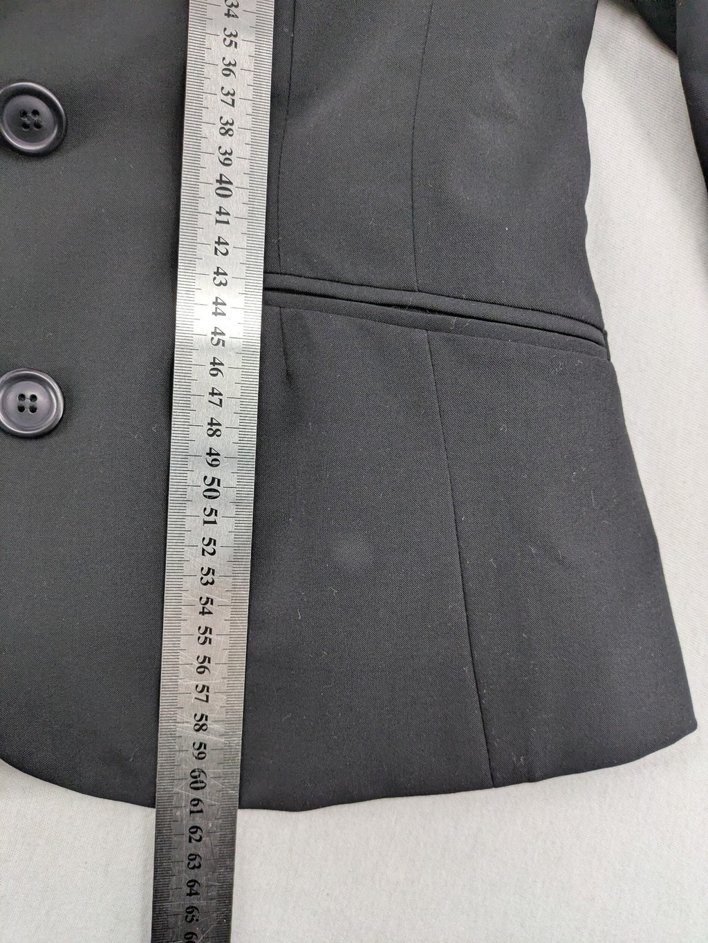 Lindex black blazer coat two-button design with subtle embroidery and tailored silhouette.