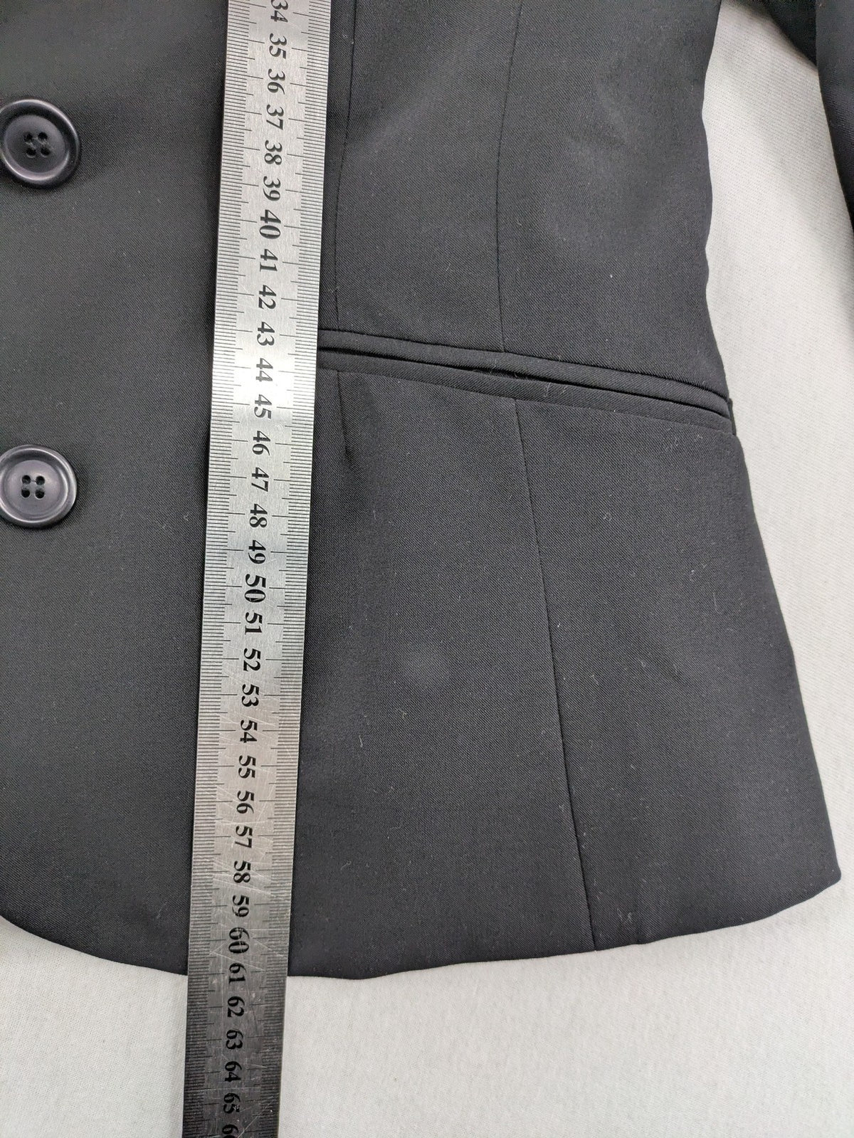 Lindex black blazer coat two-button design with subtle embroidery and tailored silhouette.