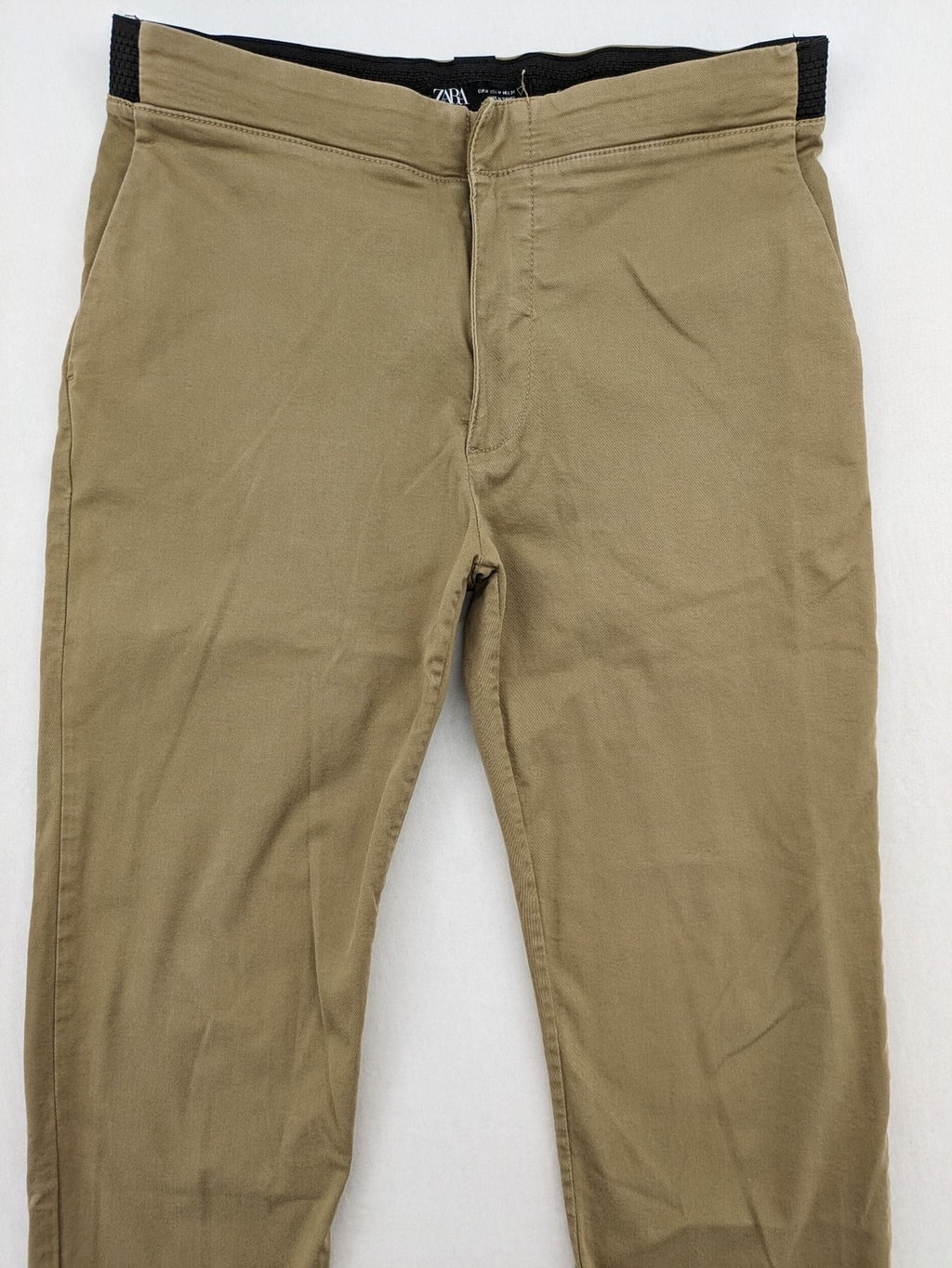 Zara khaki pants with elastic waistband, made from stretch cotton blend for comfort.