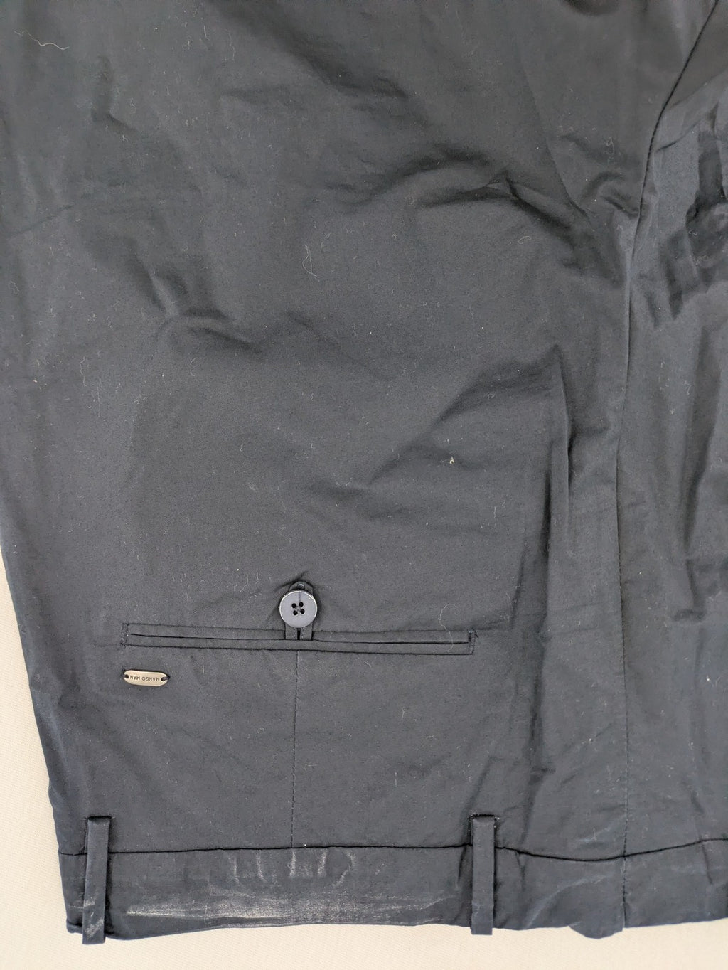 Mango Man black chinos flat front design with zipper and button closure.