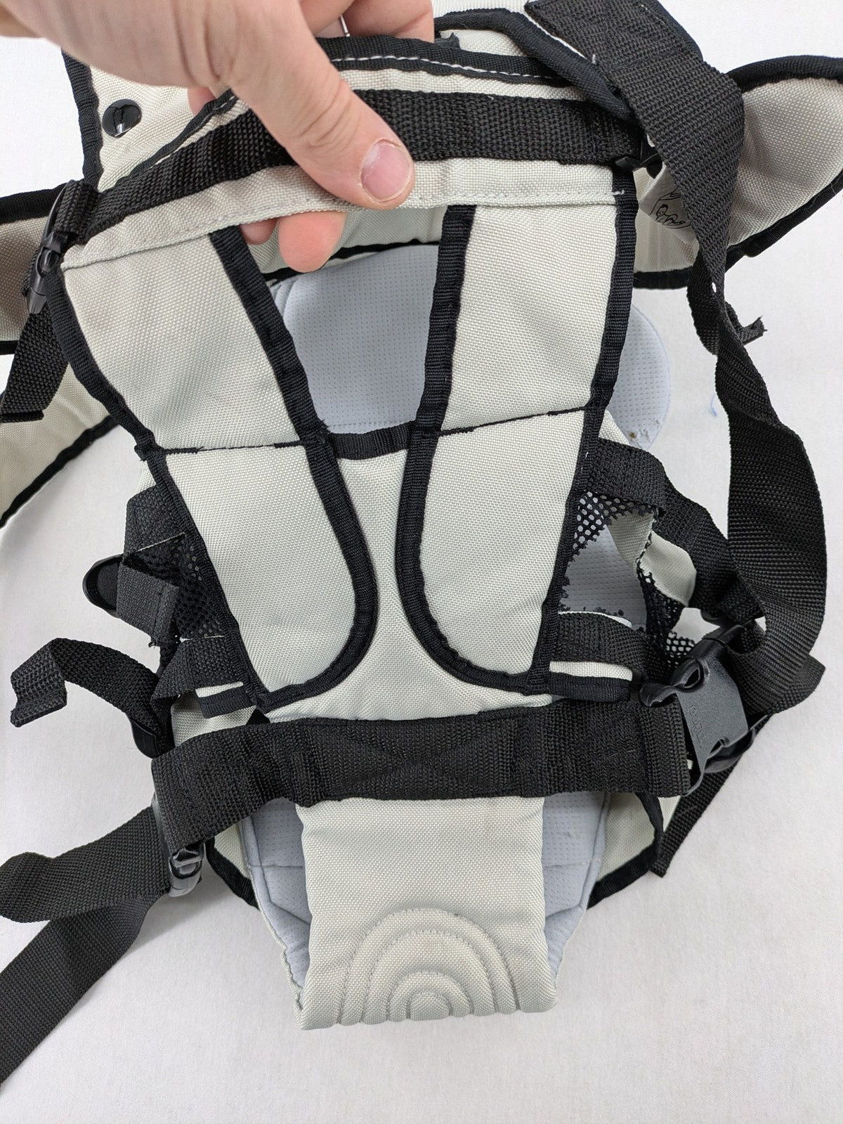 Chicco beige and black baby carrier adjustable straps with padded support for comfort.