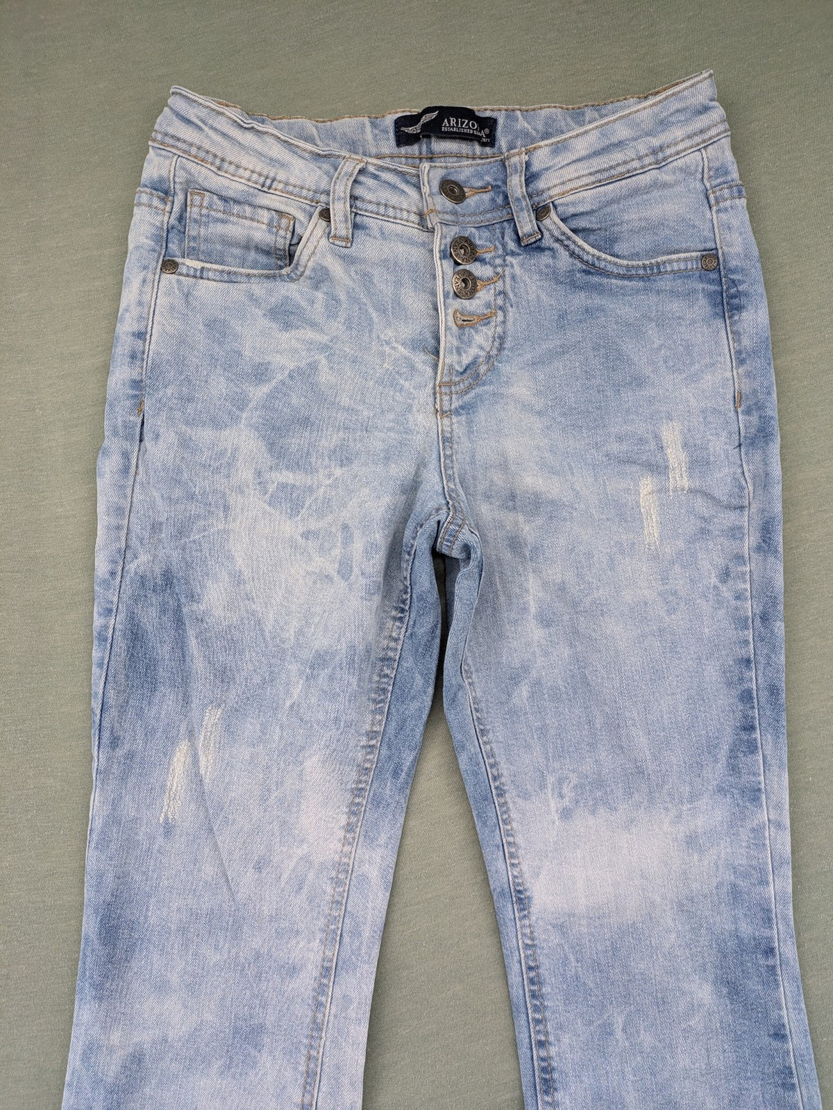 Arizona blue flare jeans with acid wash, button fly, and stretch denim material.