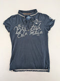 Soccx blue polo shirt with British Columbia graphic, embroidered patches, and striped collar.