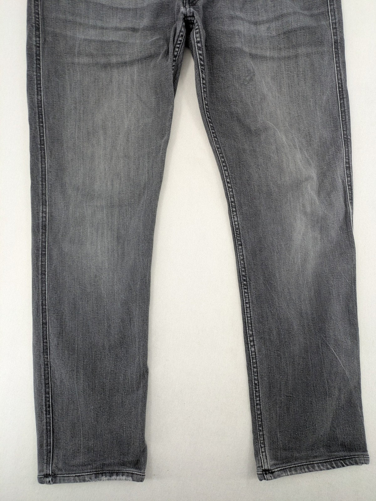 Replay grey straight jeans faded wash five-pocket style with logo on pocket.