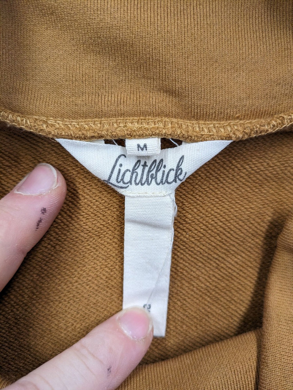 ALS orange crop top sweatshirt with roll neck and embroidered Lichtblick logo.