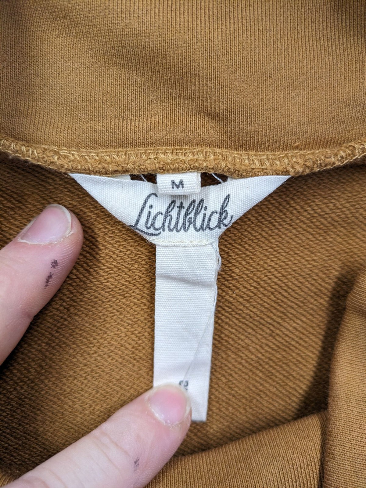 ALS orange crop top sweatshirt with roll neck and embroidered Lichtblick logo.