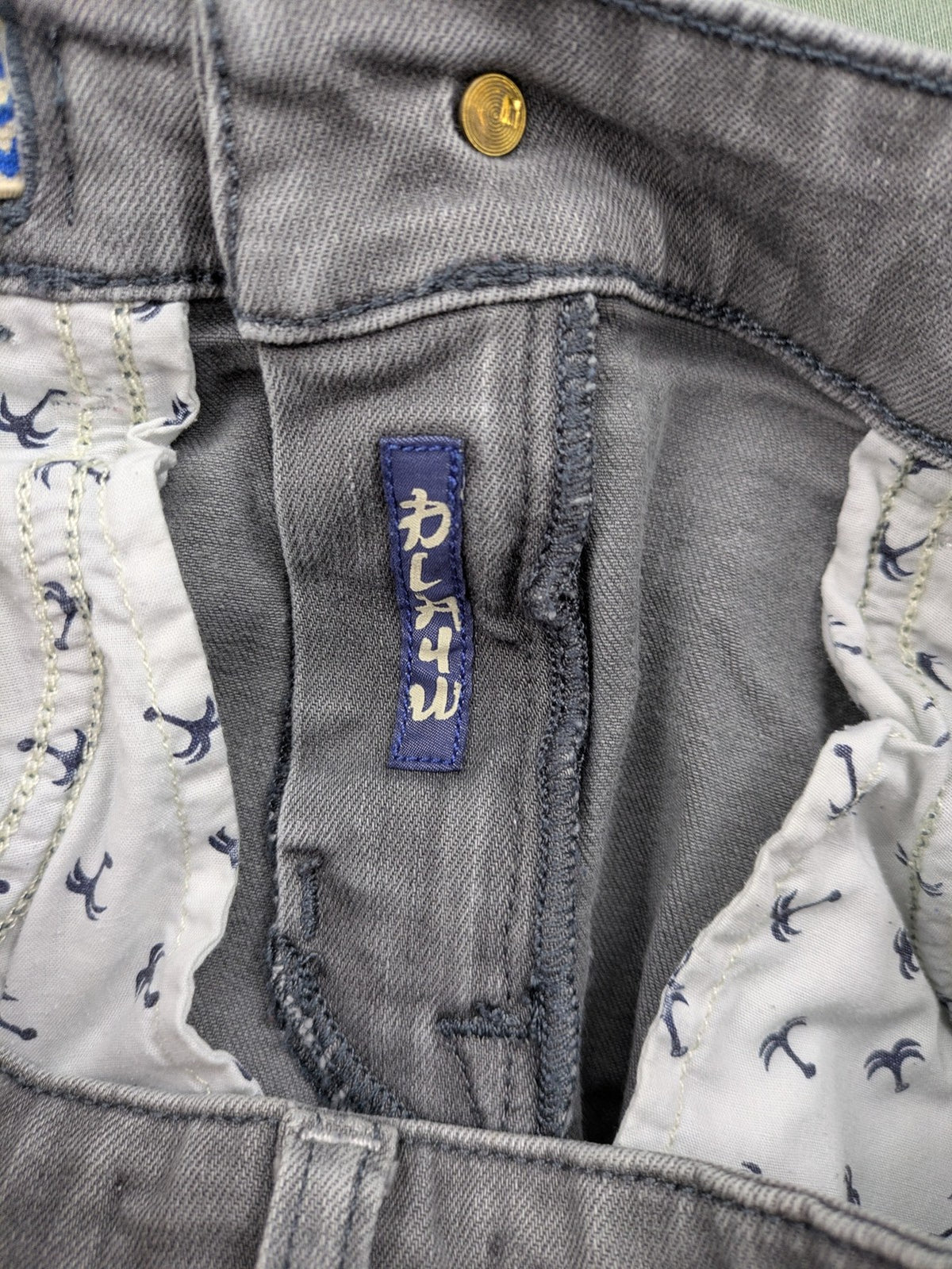 Scotch & Soda grey straight jeans with classic five-pocket design and logo patch.