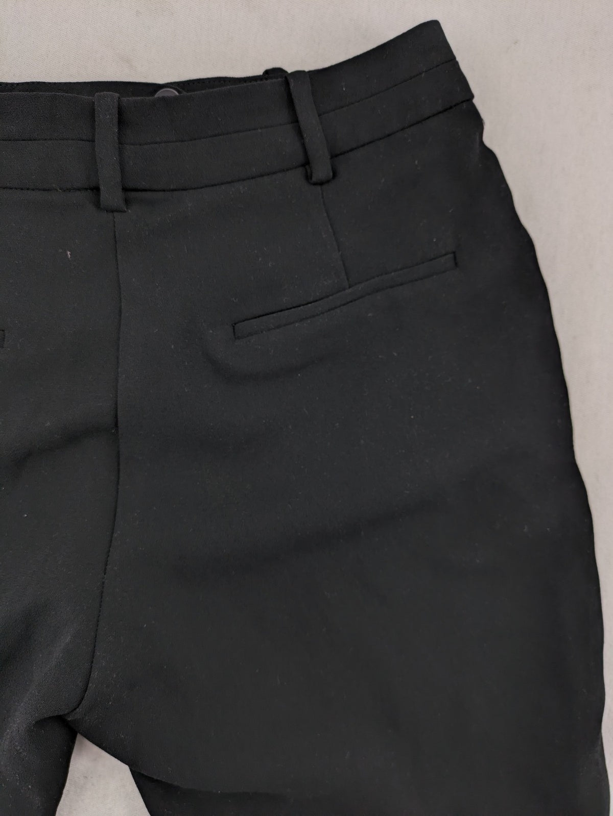 Mango Suit black trousers with zipper, belt loops, and front slant pockets.