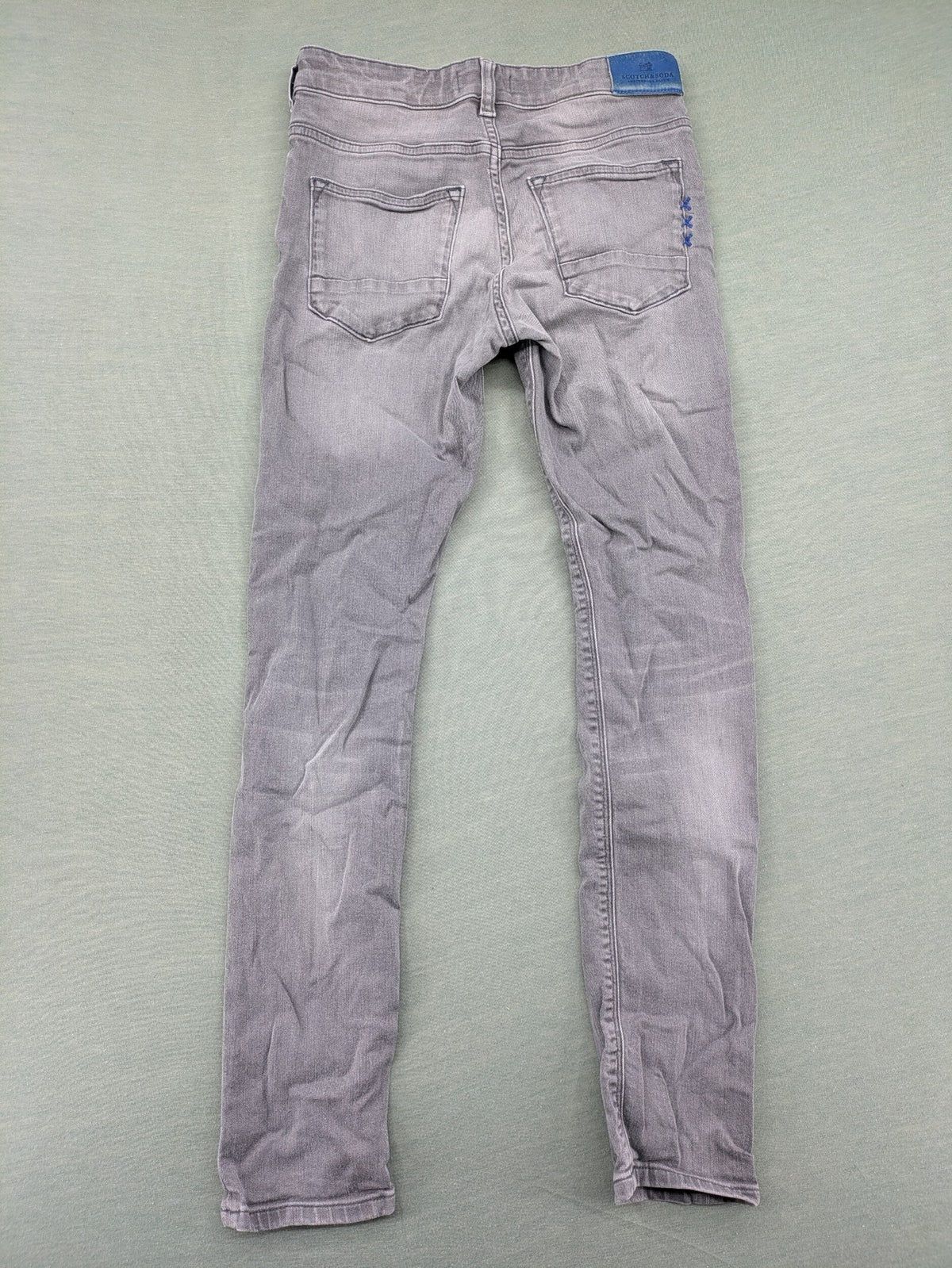 Scotch & Soda grey straight jeans with classic five-pocket design and logo patch.