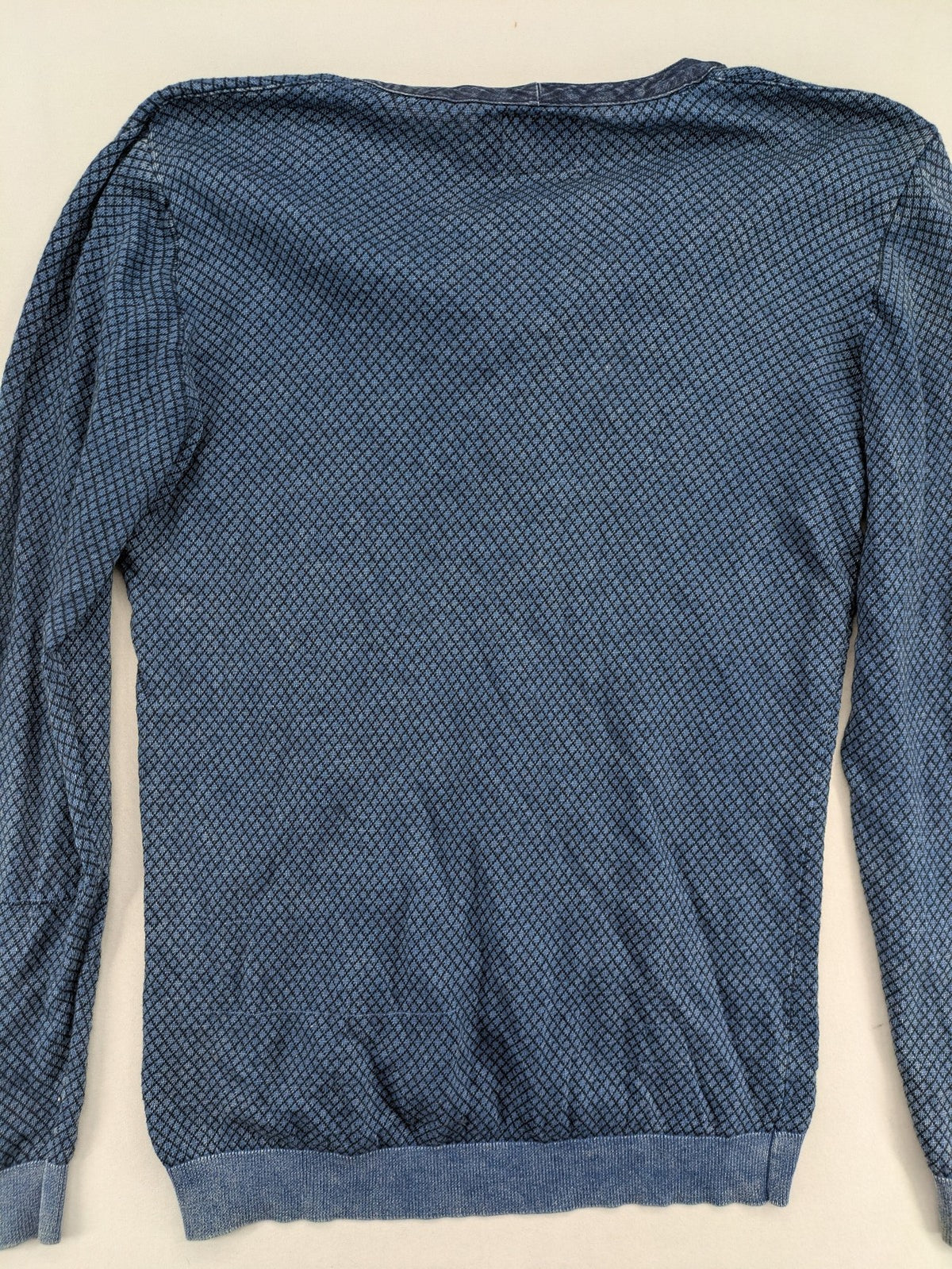 Gas blue turtle neck jumper with diamond pattern, three-button Henley neck, and contrasting trim.