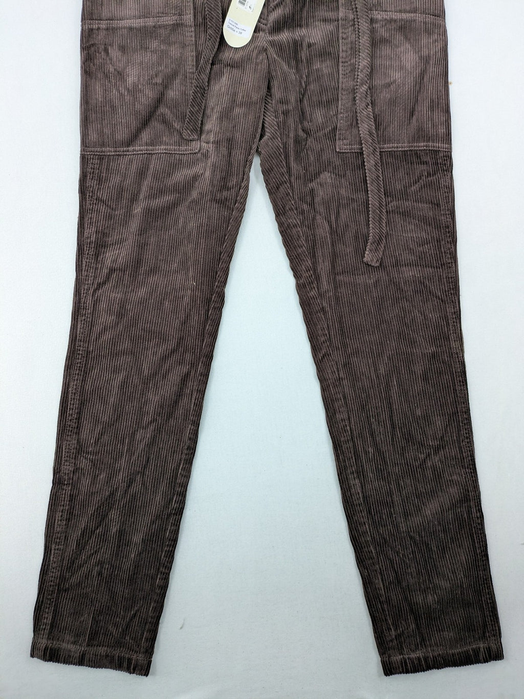Alma & Lovis brown cord pants with drawstring, casual fit, and patch pockets.
