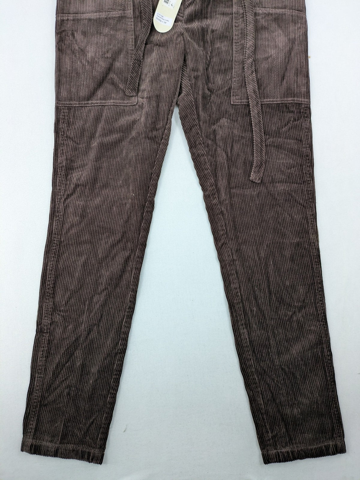 Alma & Lovis brown cord pants with drawstring, casual fit, and patch pockets.