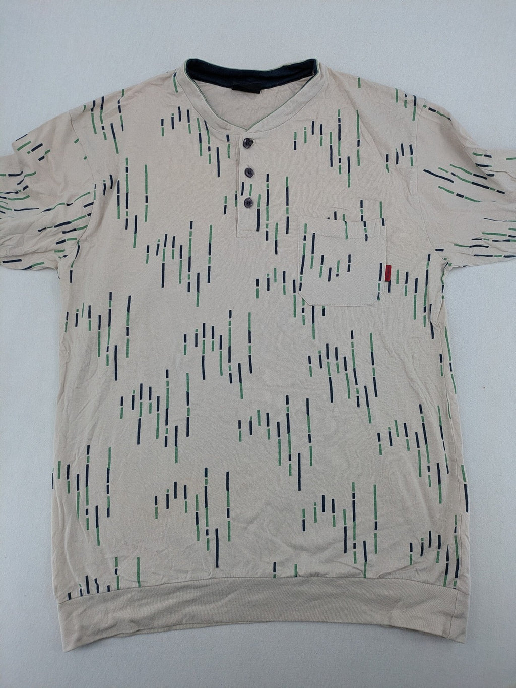 Normann beige striped long sleeve Henley shirt with button placket and chest pocket.