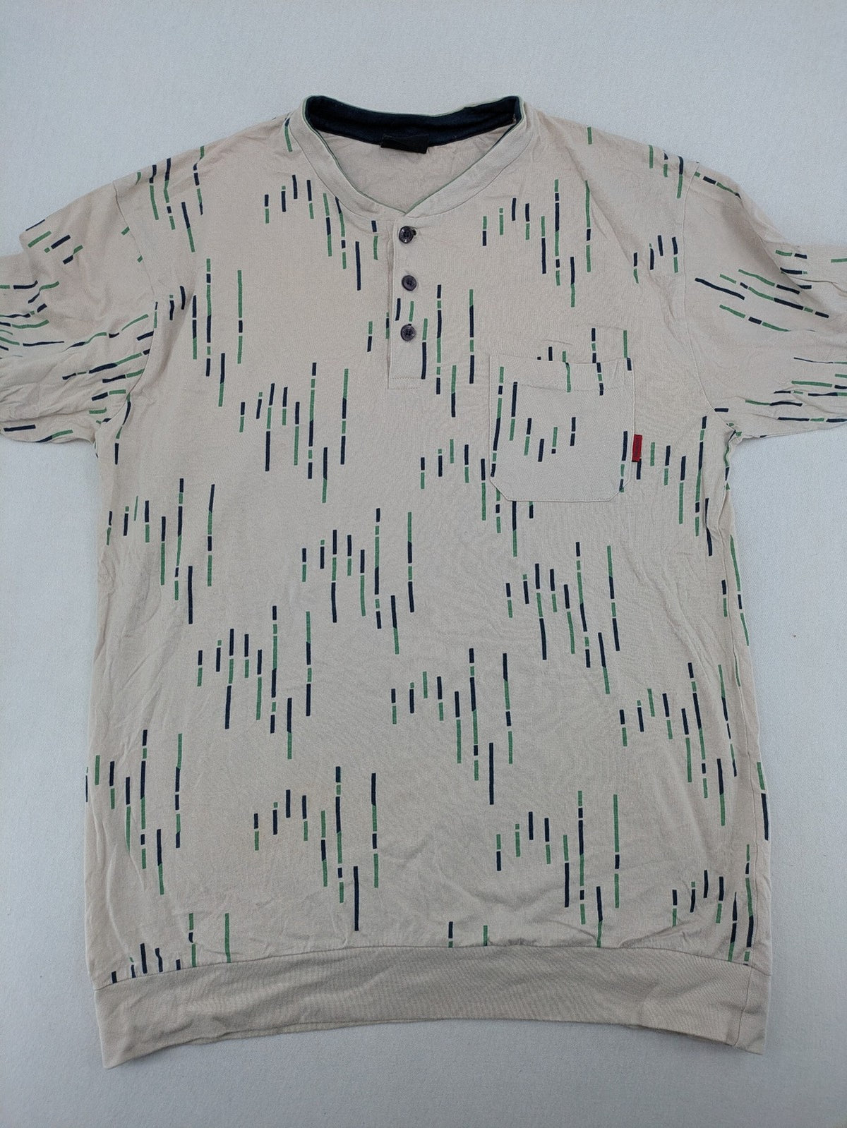 Normann beige striped long sleeve Henley shirt with button placket and chest pocket.