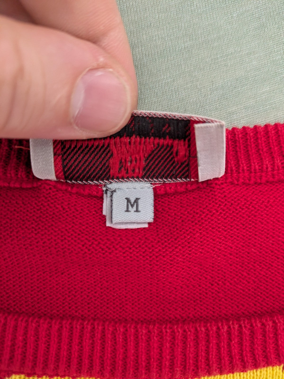 MAYSER multi turtle neck jumper argyle pattern in red, yellow, and black cotton.