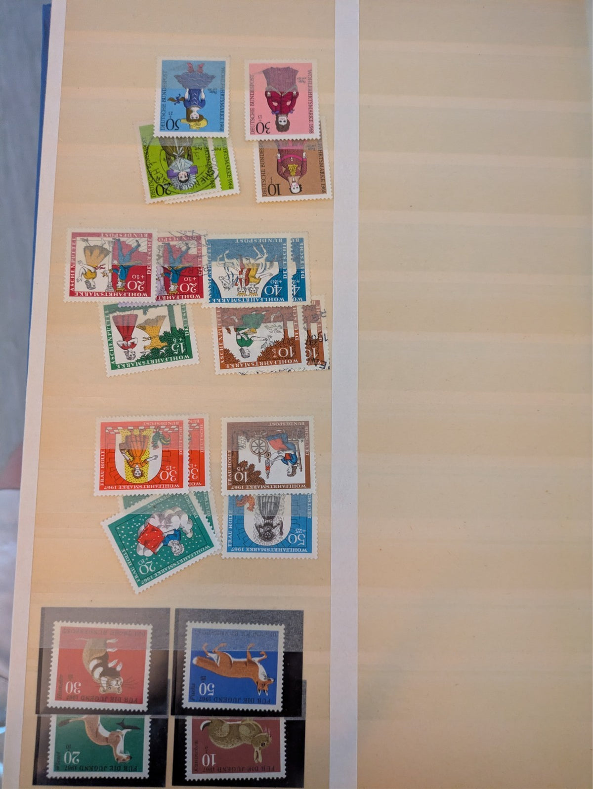 Beige postage stamp album featuring over 1000 stamps from Germany and Europe.