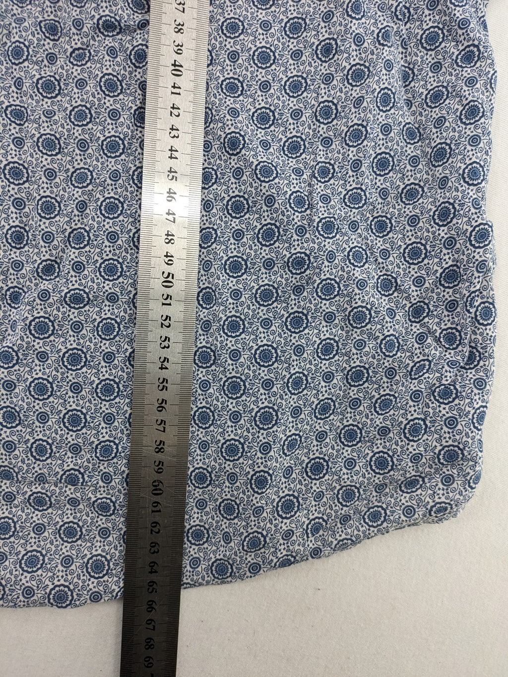 M/L blue and grey tunic top with geometric pattern and stand-up collar.