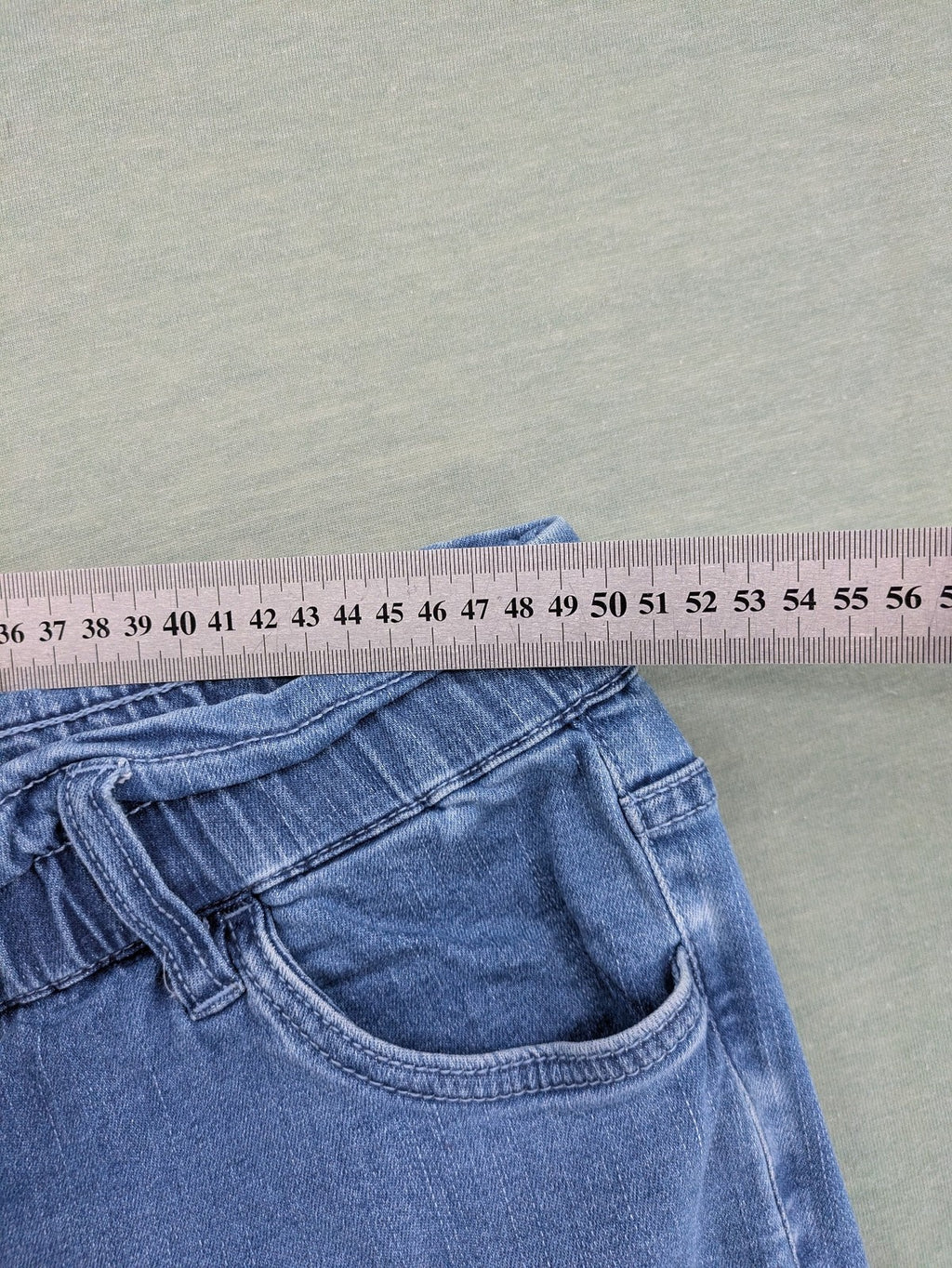 Bodyflirt blue high waist paperbag jeans shorts with button fly and rolled cuffs.