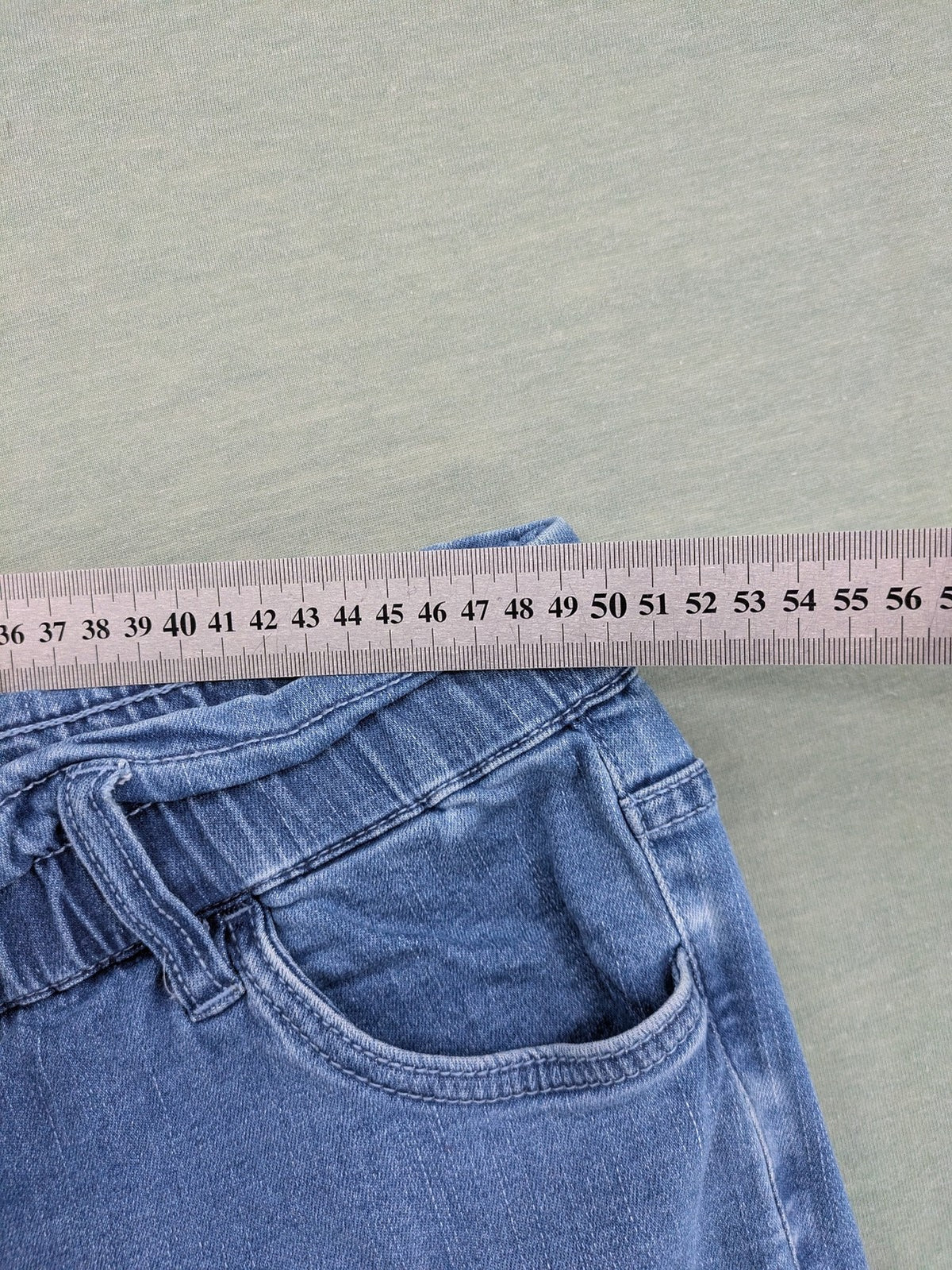 Bodyflirt blue high waist paperbag jeans shorts with button fly and rolled cuffs.