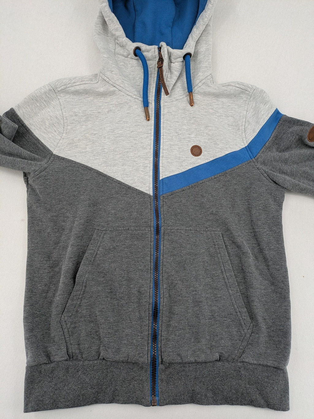 ALIFE turtle neck jumper blue grey colorblock design with logo details and soft cotton blend.