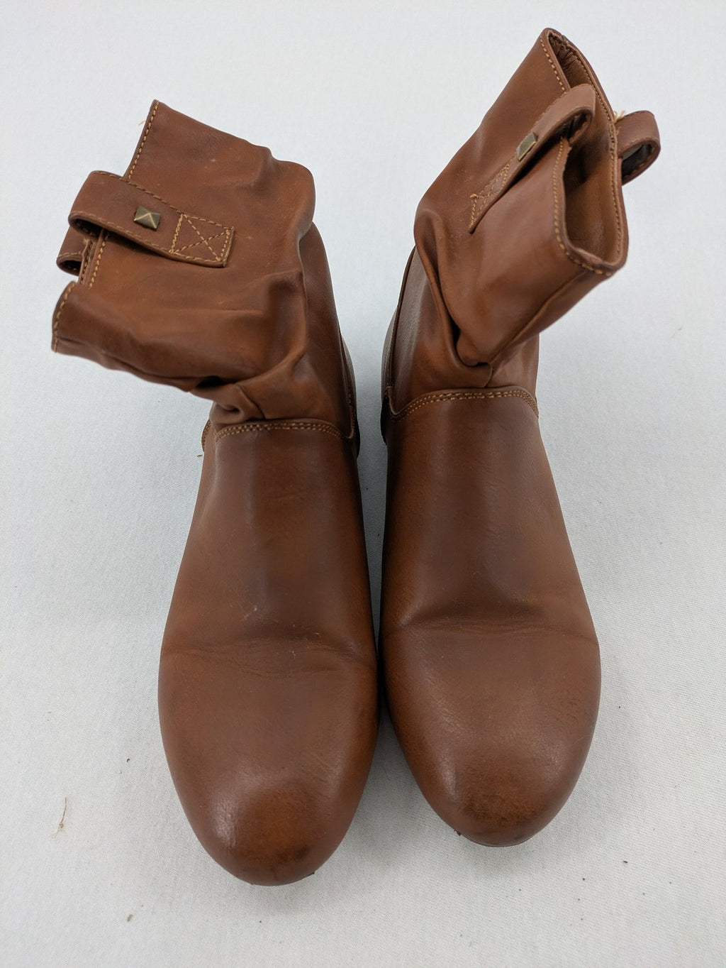 Van Hill brown ankle boots with slouchy design, fold-over cuff, and soft lining.