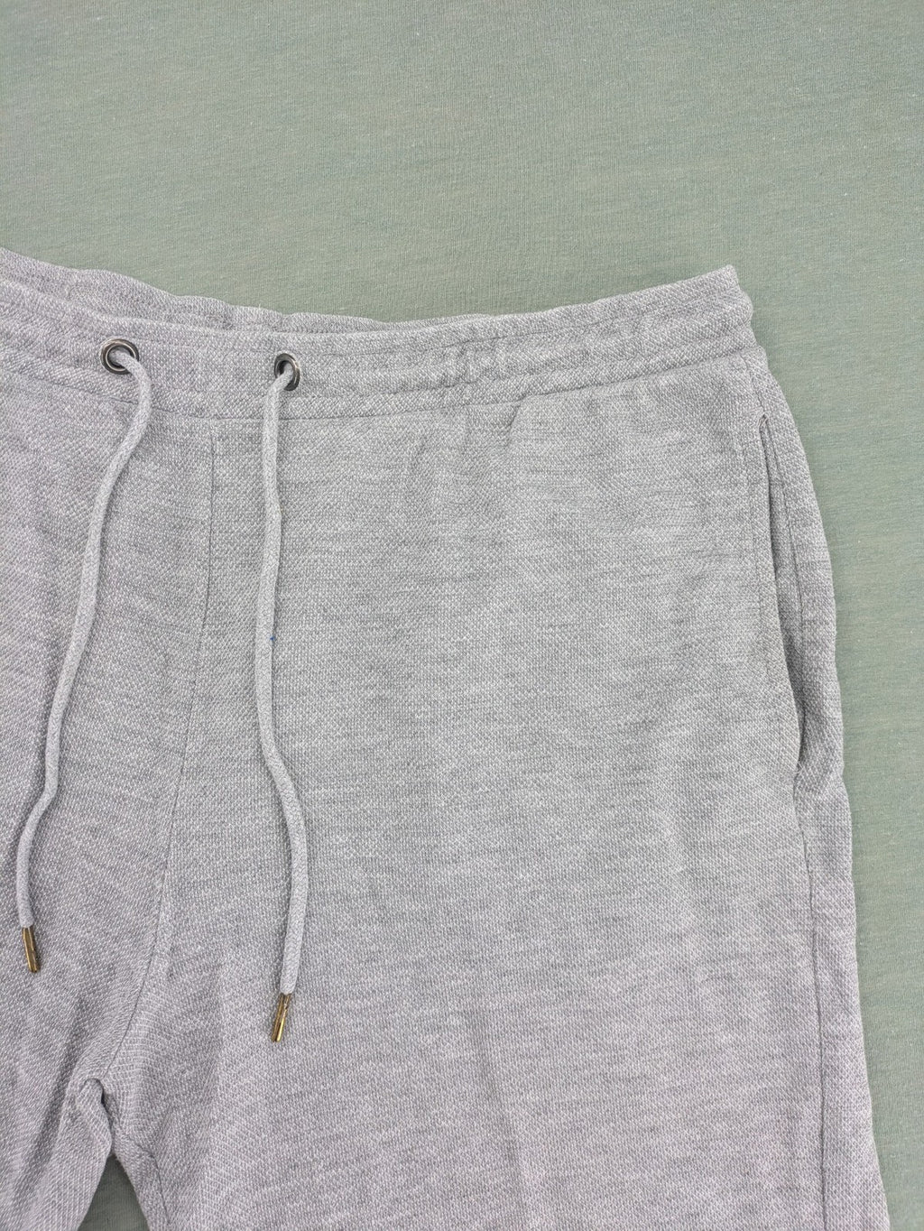 Livergy grey sweat shorts with elastic waistband, drawstring, and side pockets.
