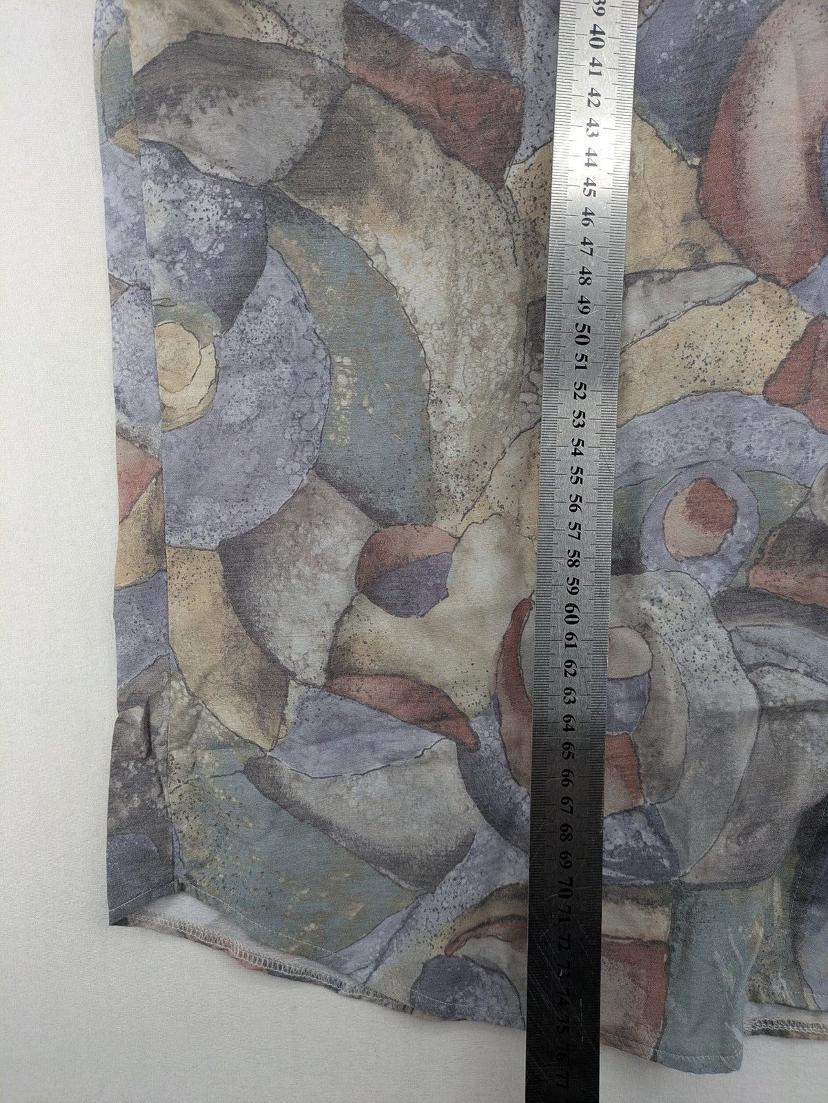Club D'Amingo short sleeve shirt multi abstract geometric pattern in earthy tones.