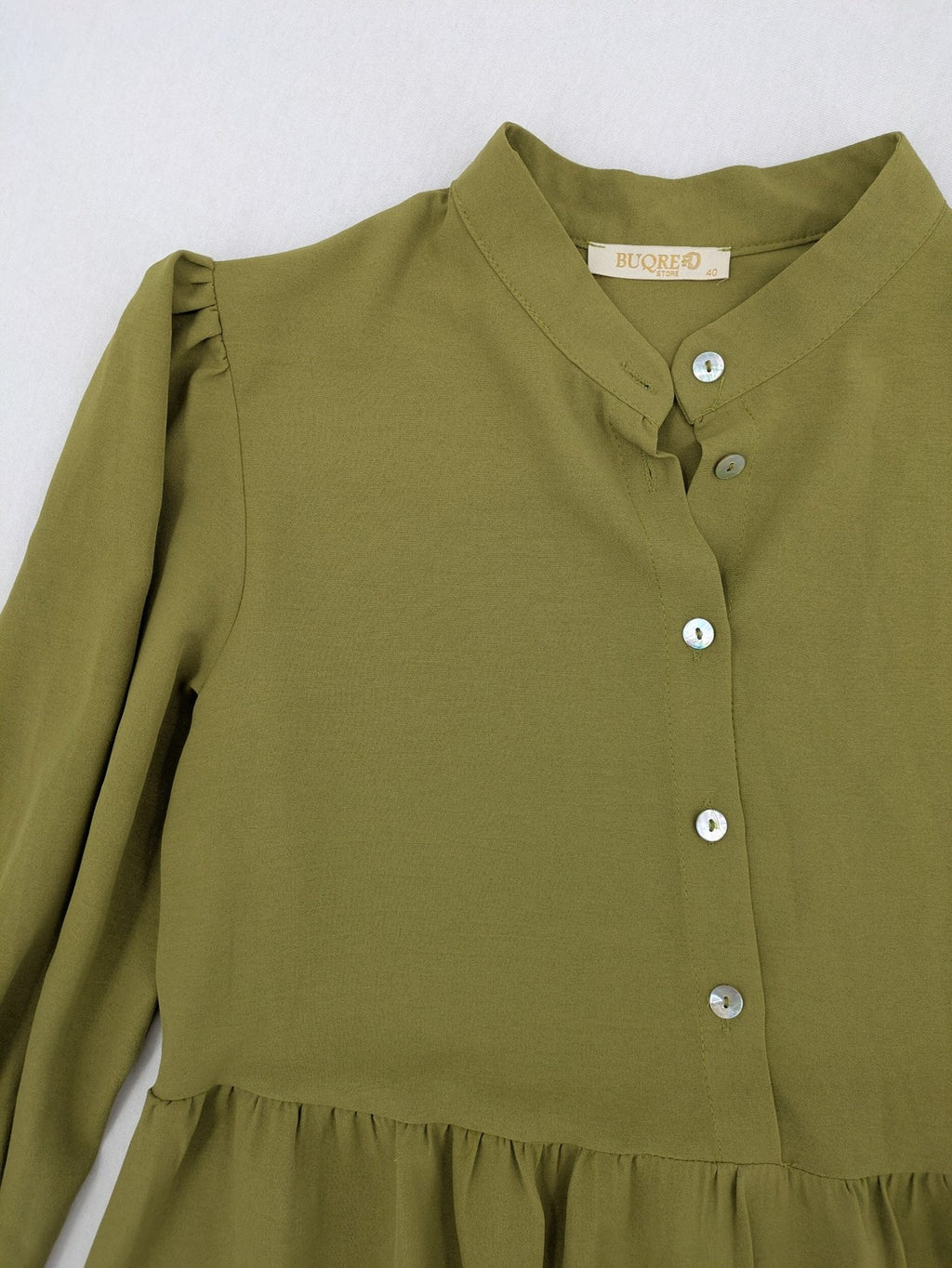 Buqre Store khaki A-line dress with puff sleeves, ruffled cuffs, and button placket.