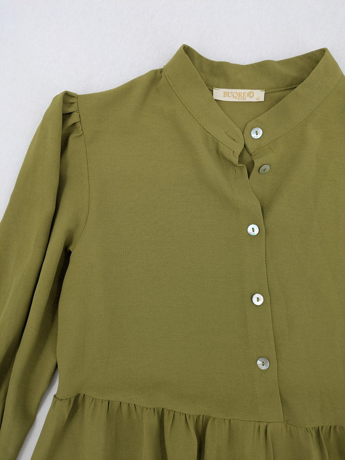 Buqre Store khaki A-line dress with puff sleeves, ruffled cuffs, and button placket.