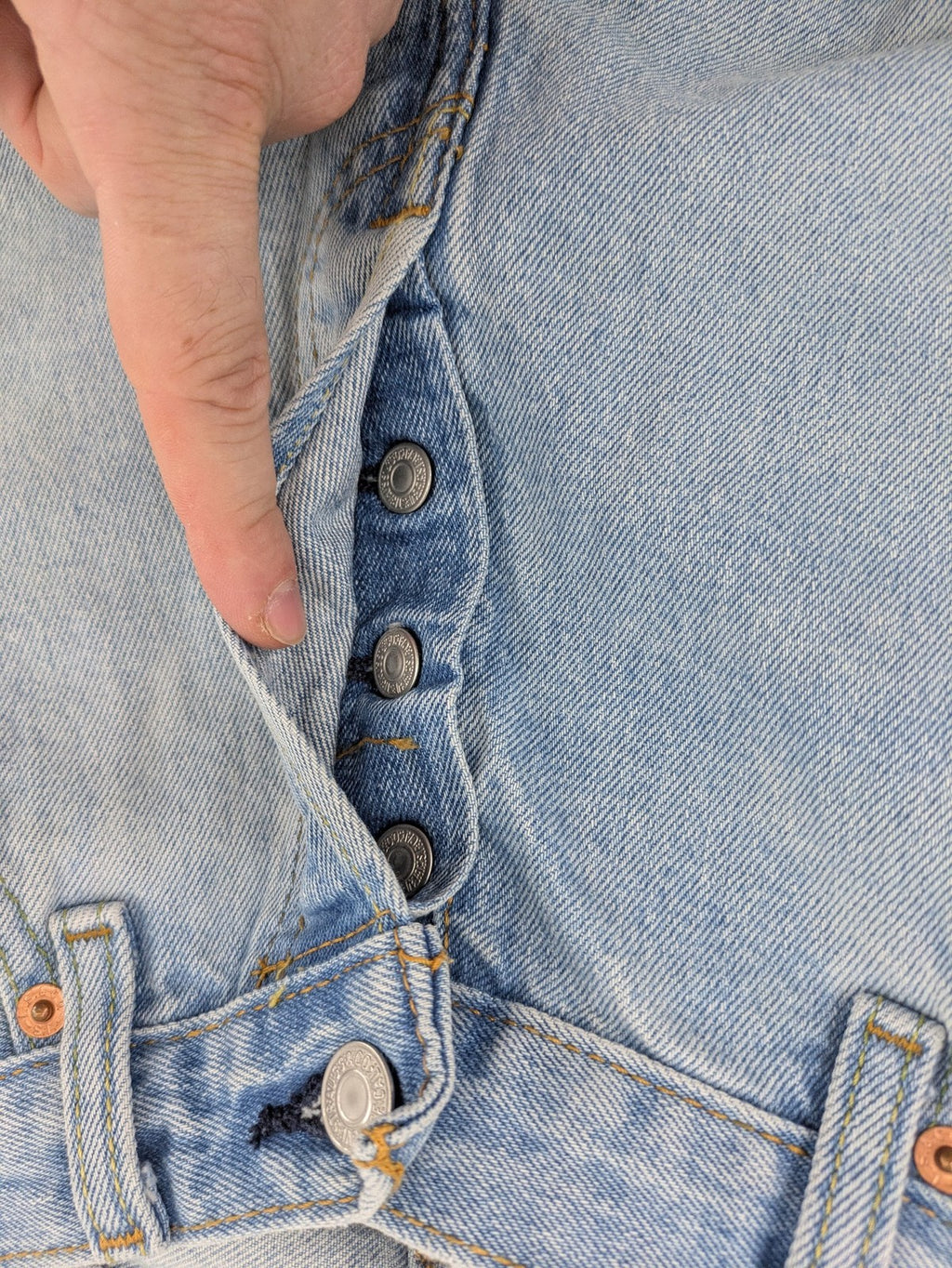 Levi's blue straight jeans light wash denim with button fly and classic fit.