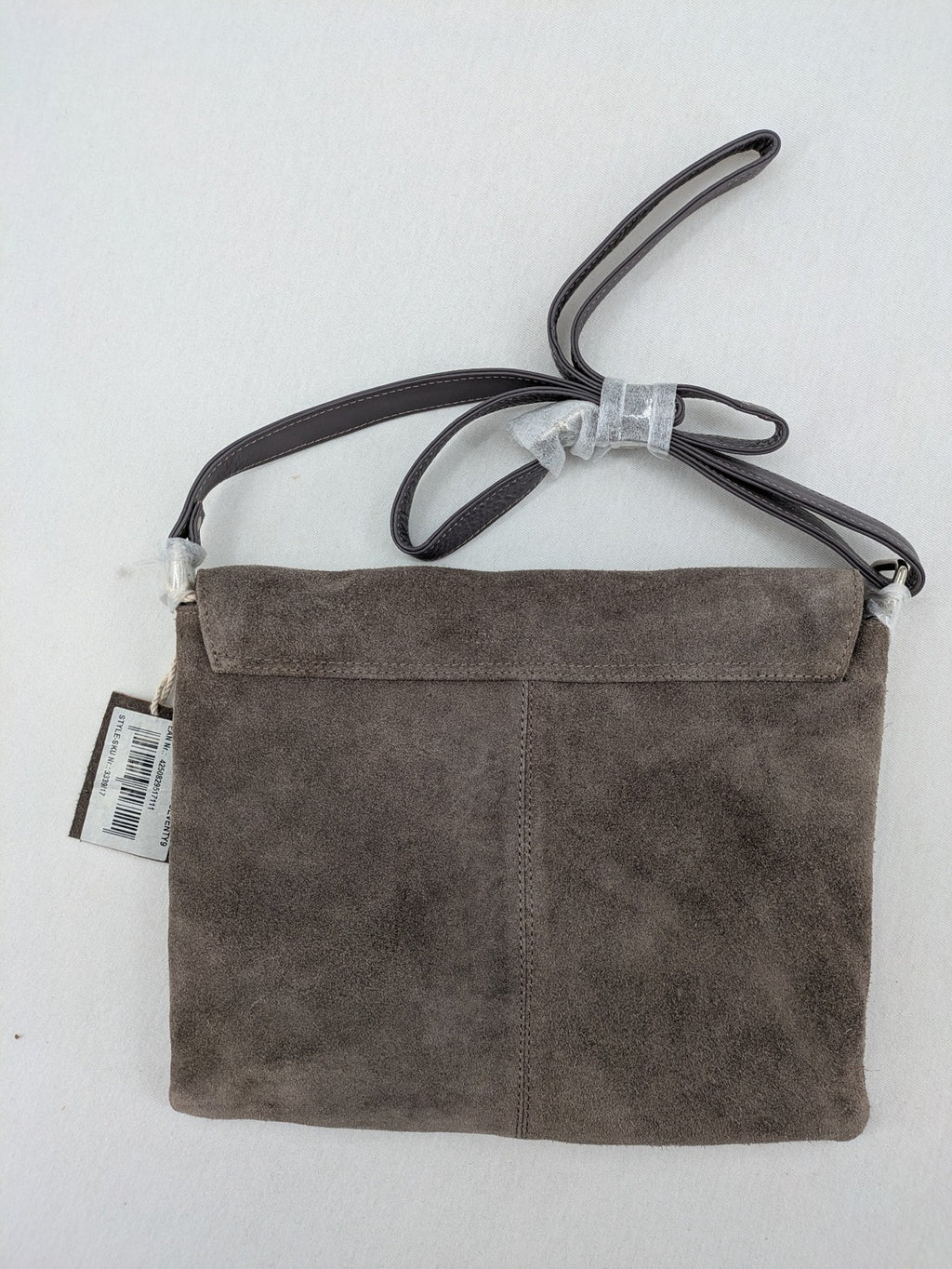 CNTMP grey suede crossbody handbag with flap and silver twist lock closure.