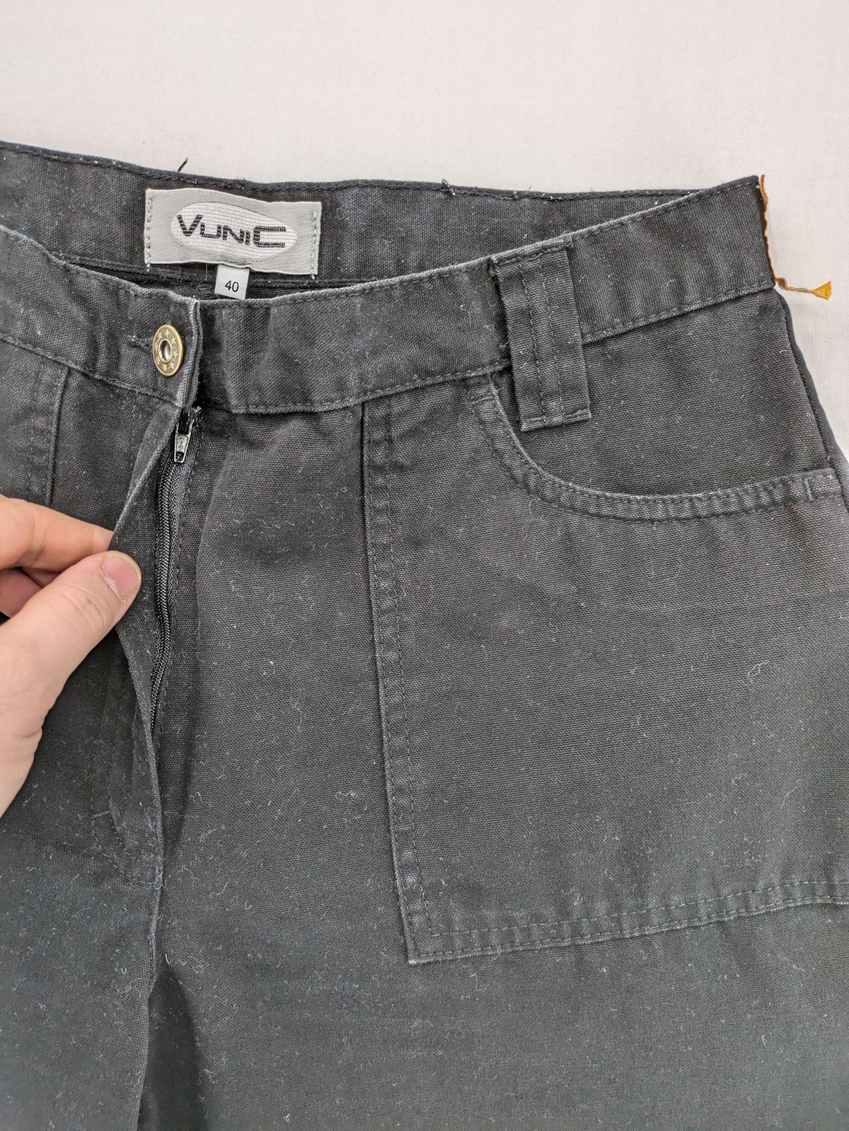 Vunic black cargo pants high-waisted straight leg cotton with zipper and button closure.